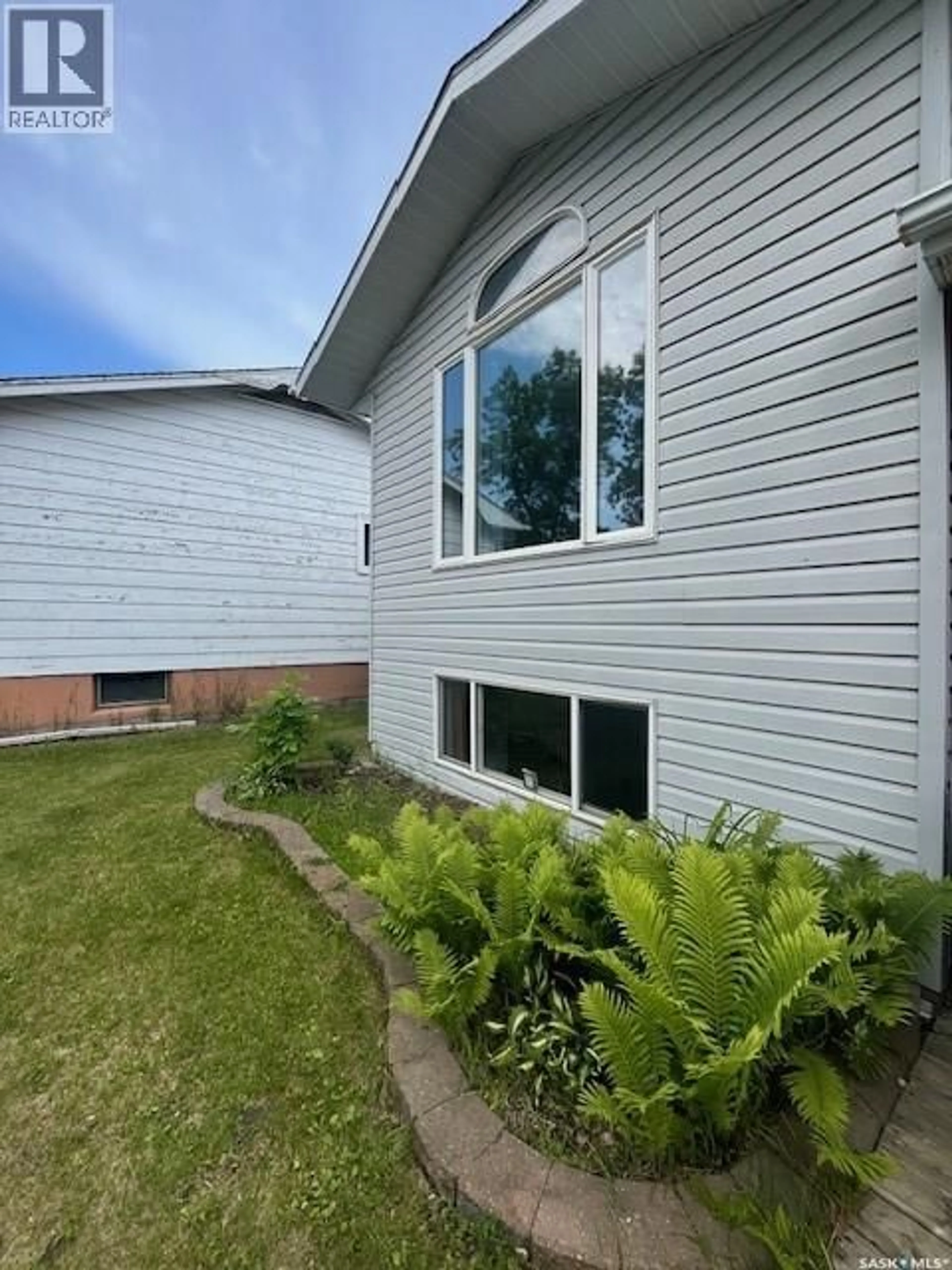 Home with vinyl exterior material, street for 414 1ST STREET, Meadow Lake Saskatchewan S9X1E9