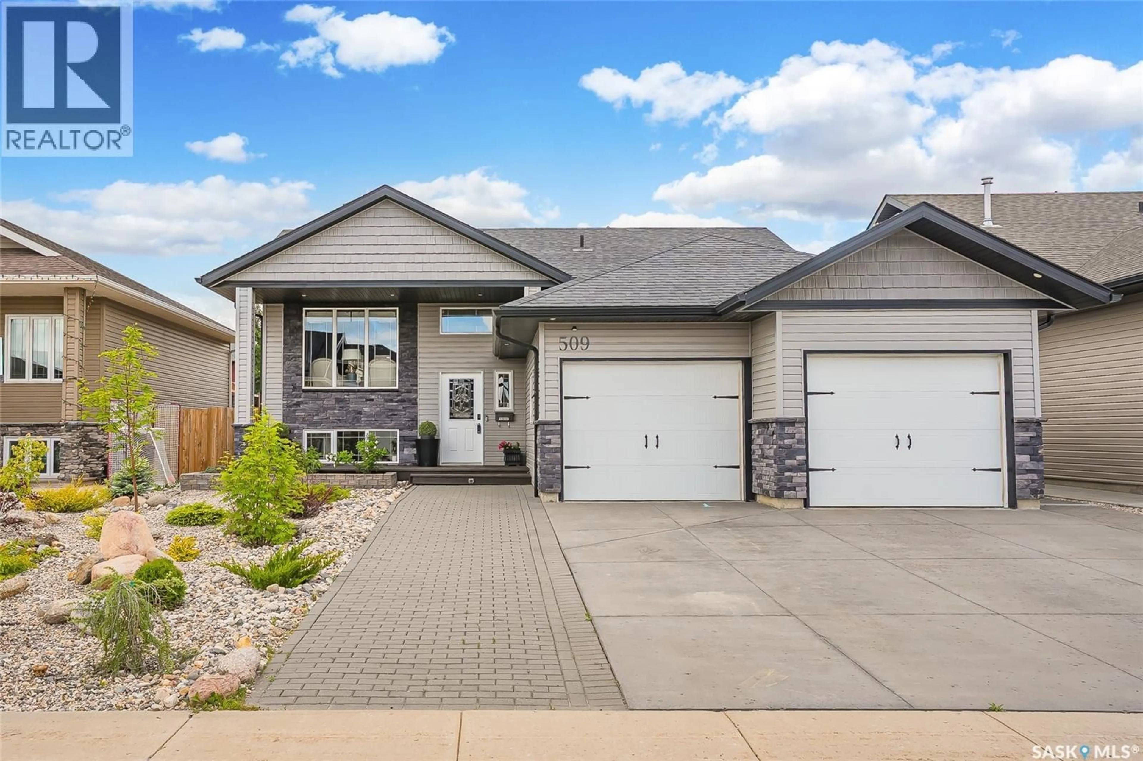 Home with brick exterior material, street for 509 CHERRY LANE, Warman Saskatchewan S0K4S2