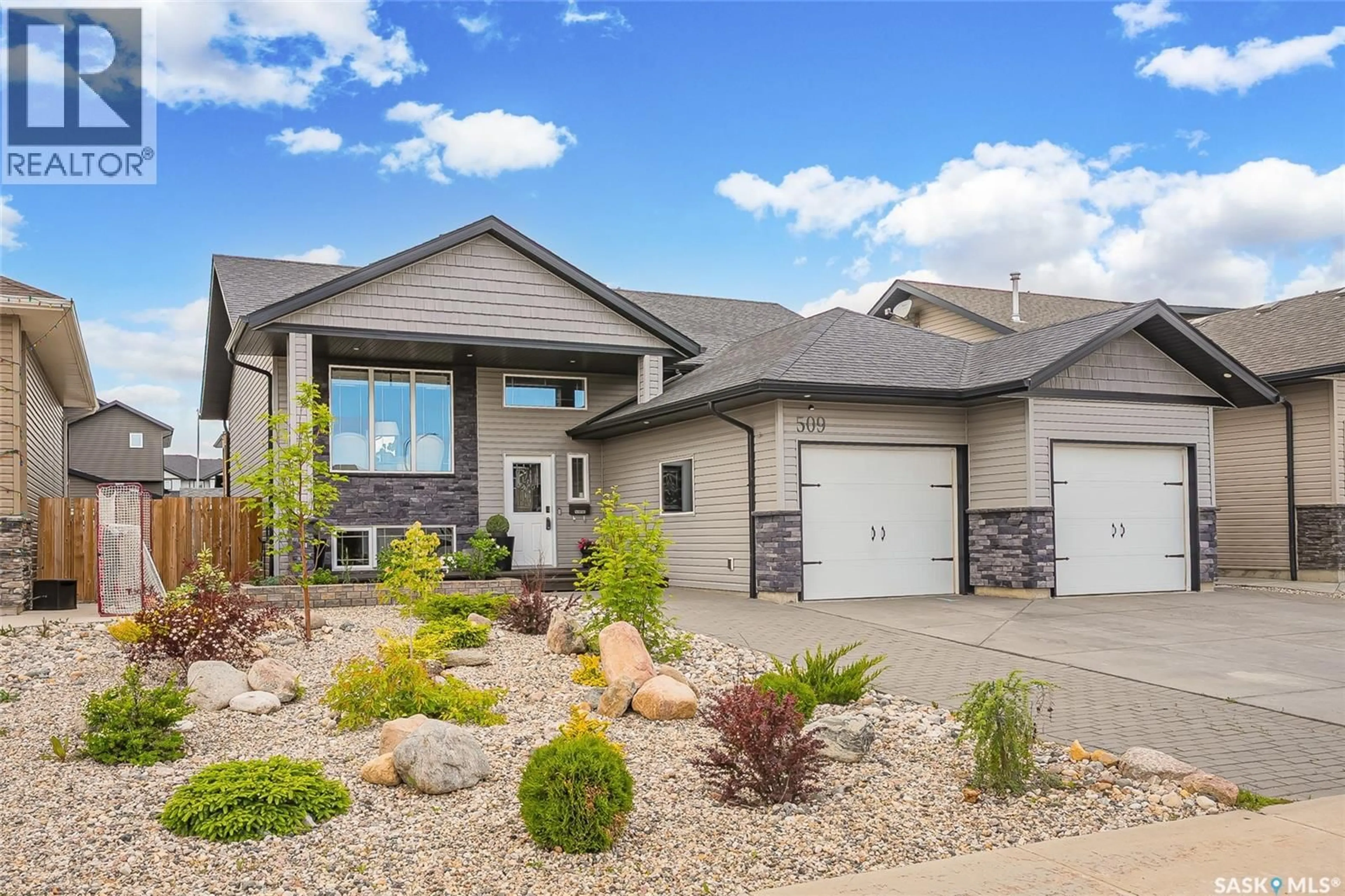 Home with vinyl exterior material, street for 509 CHERRY LANE, Warman Saskatchewan S0K4S2
