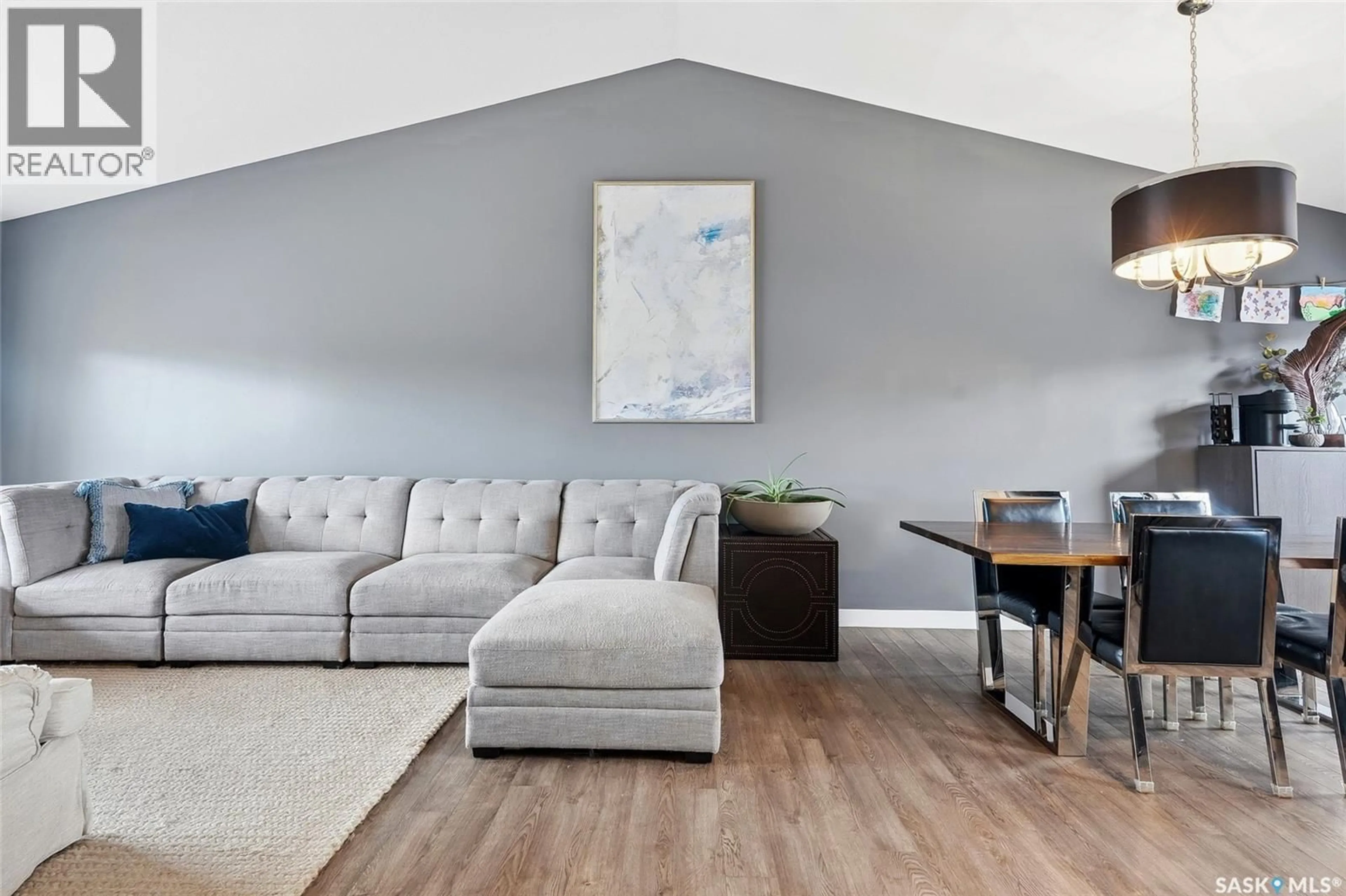 Living room with furniture, wood/laminate floor for 509 CHERRY LANE, Warman Saskatchewan S0K4S2