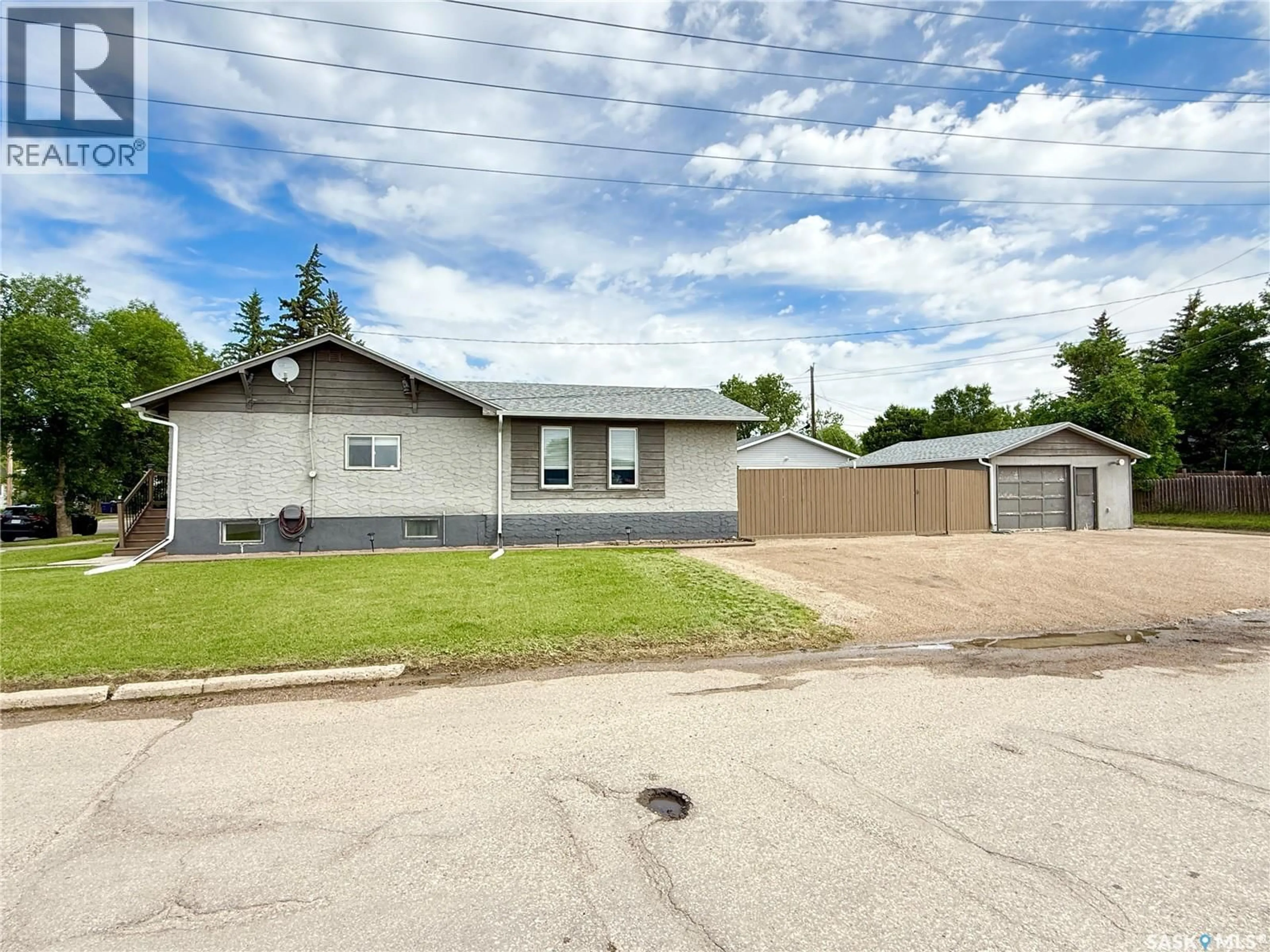 A pic from outside/outdoor area/front of a property/back of a property/a pic from drone, street for 4 9TH STREET, Weyburn Saskatchewan S4H1E5