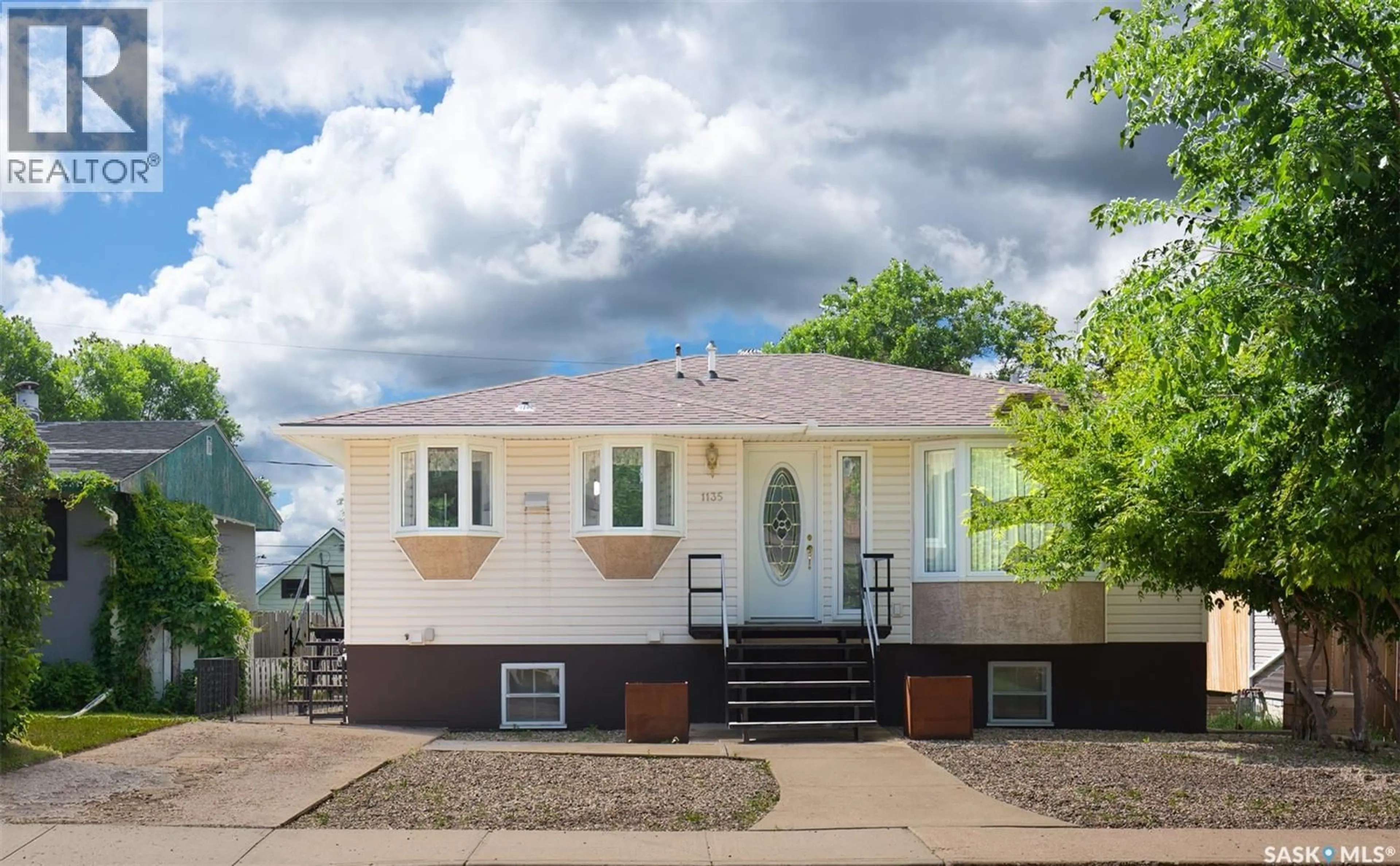 Home with vinyl exterior material, street for 1135 CARIBOU STREET, Moose Jaw Saskatchewan S6H2L8