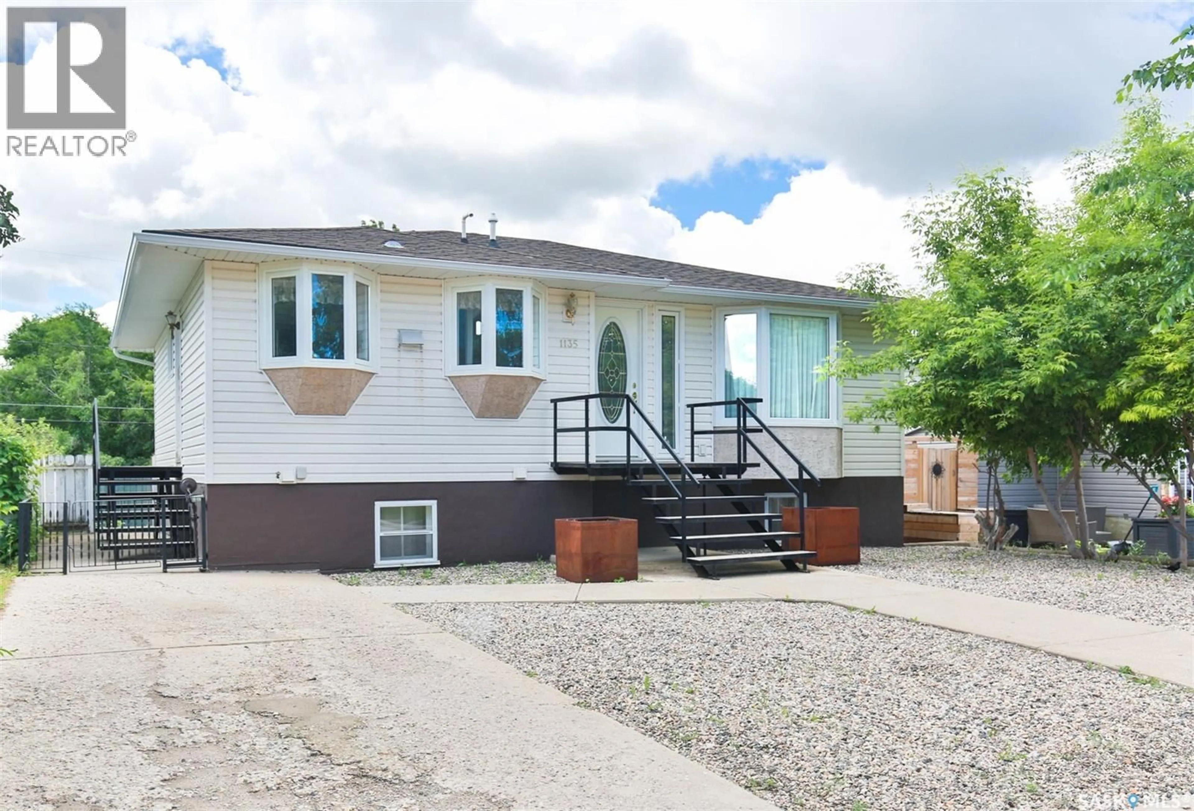Home with vinyl exterior material, street for 1135 CARIBOU STREET, Moose Jaw Saskatchewan S6H2L8