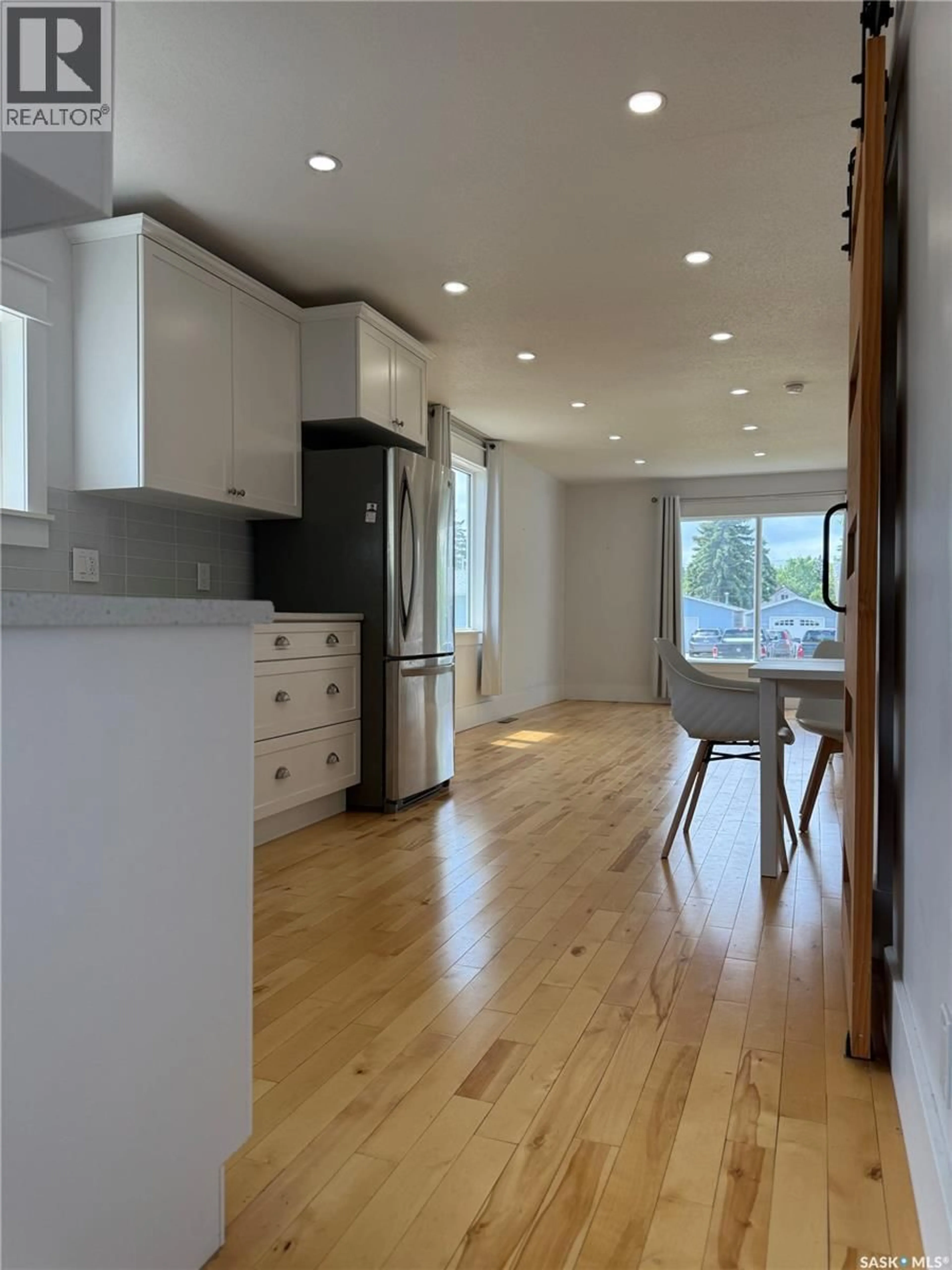 Open concept kitchen, wood/laminate floor for 390 ALBERTA STREET, Melville Saskatchewan S0A2P0