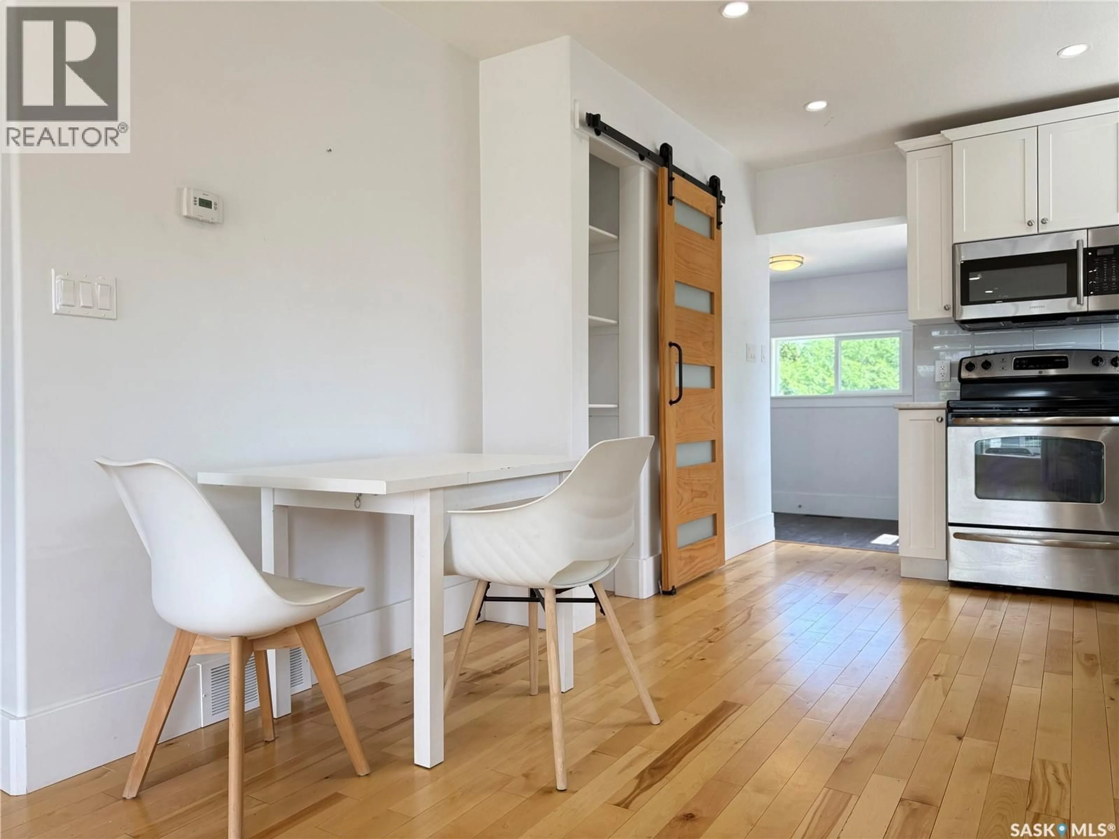 Open concept kitchen, wood/laminate floor for 390 ALBERTA STREET, Melville Saskatchewan S0A2P0