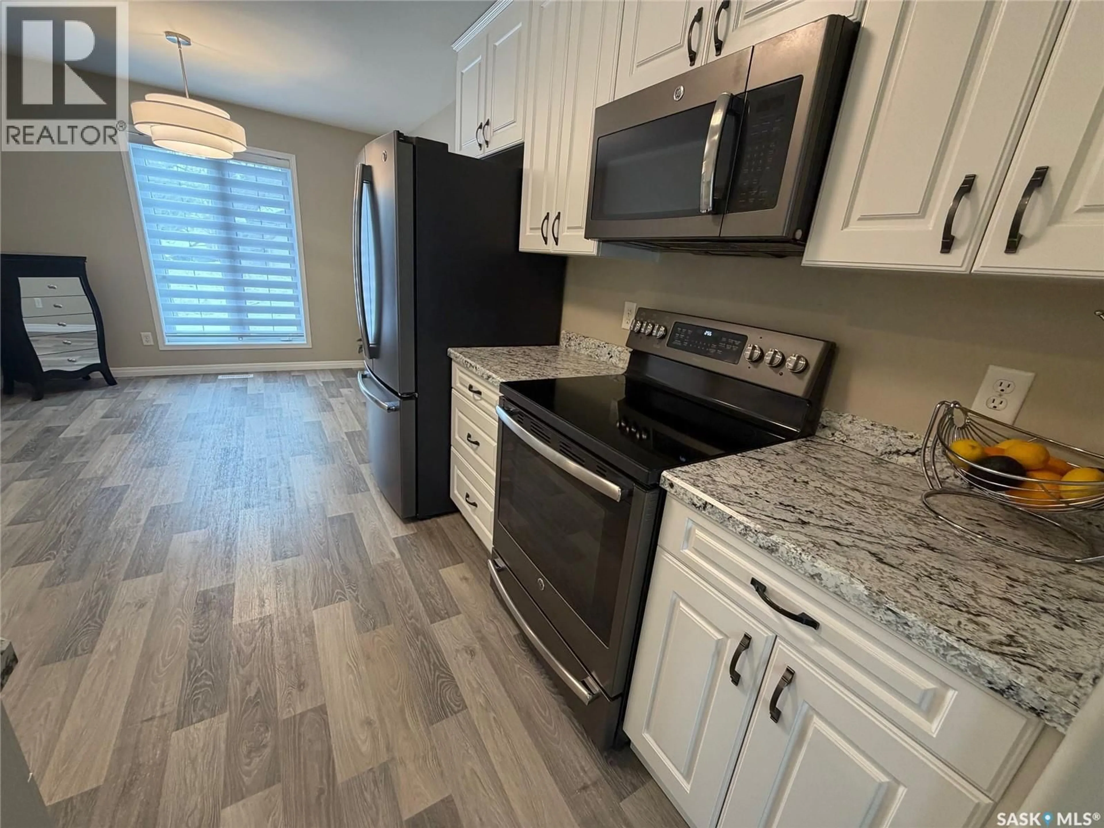 Open concept kitchen, ceramic/tile floor for 330 - 27 STODOLA COURT, Saskatoon Saskatchewan S7N4N9