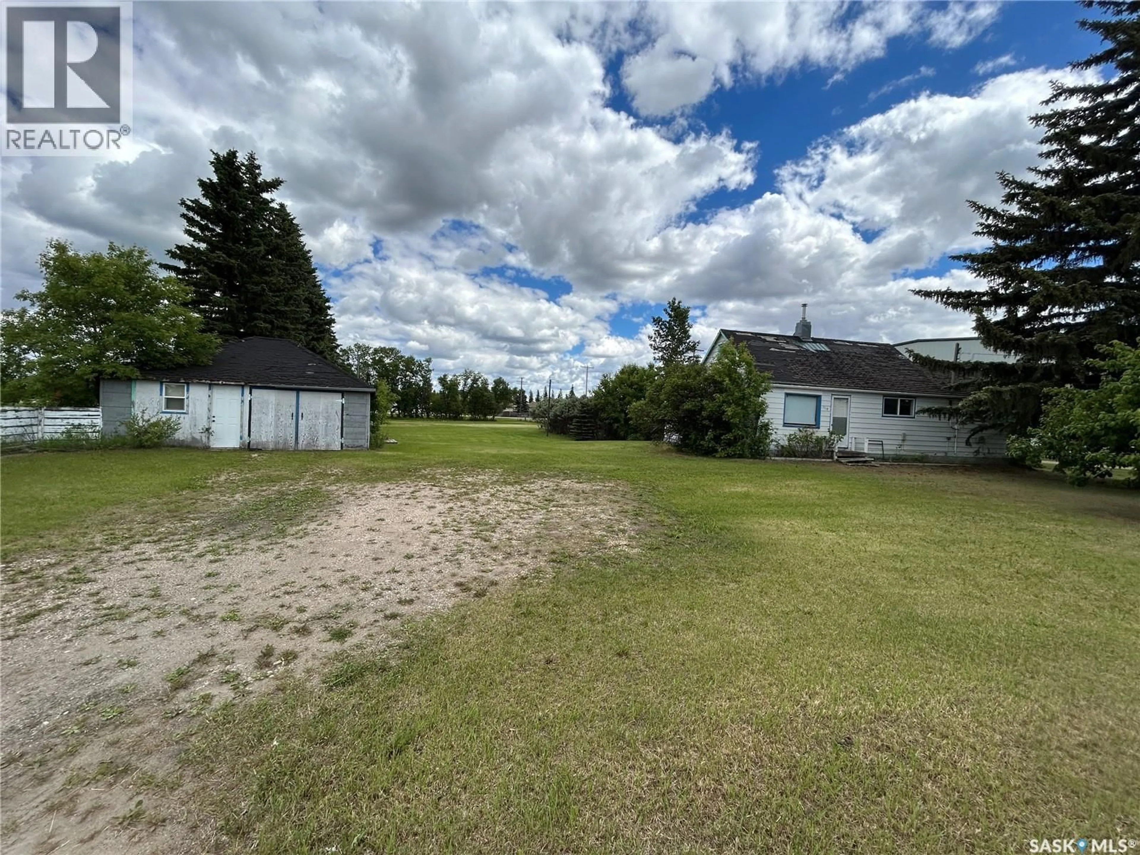 A pic from outside/outdoor area/front of a property/back of a property/a pic from drone, unknown for 119 MAIN STREET, Lanigan Saskatchewan S0K2M0