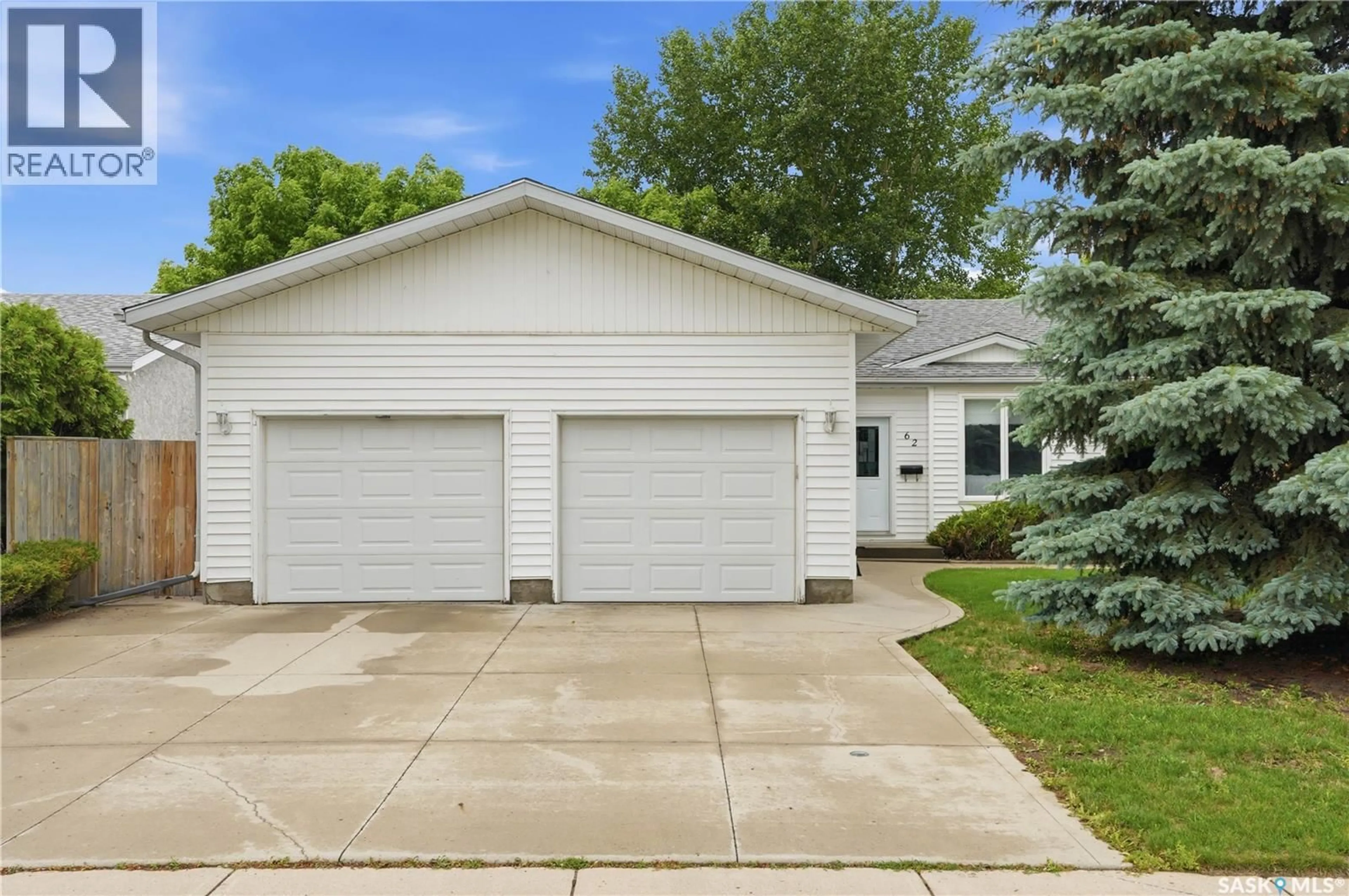 Home with vinyl exterior material, street for 62 ROBINSON CRESCENT, Saskatoon Saskatchewan S7L6N9