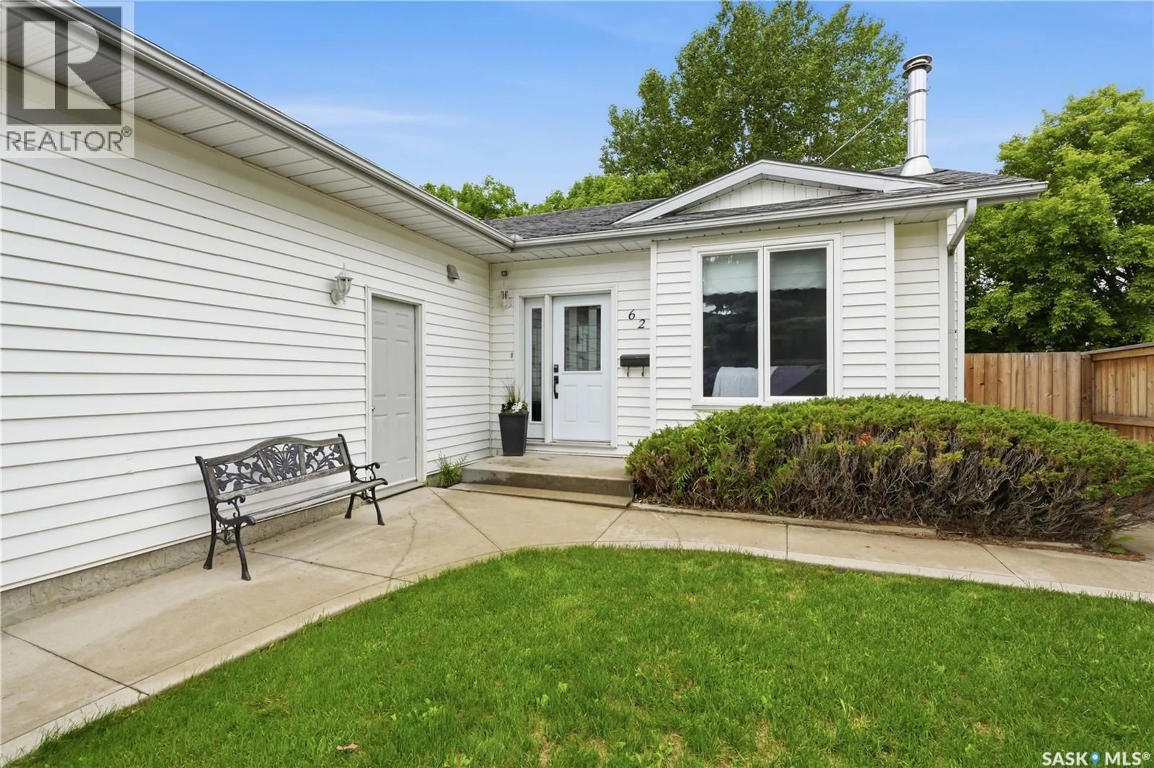 Home with vinyl exterior material, street for 62 ROBINSON CRESCENT, Saskatoon Saskatchewan S7L6N9