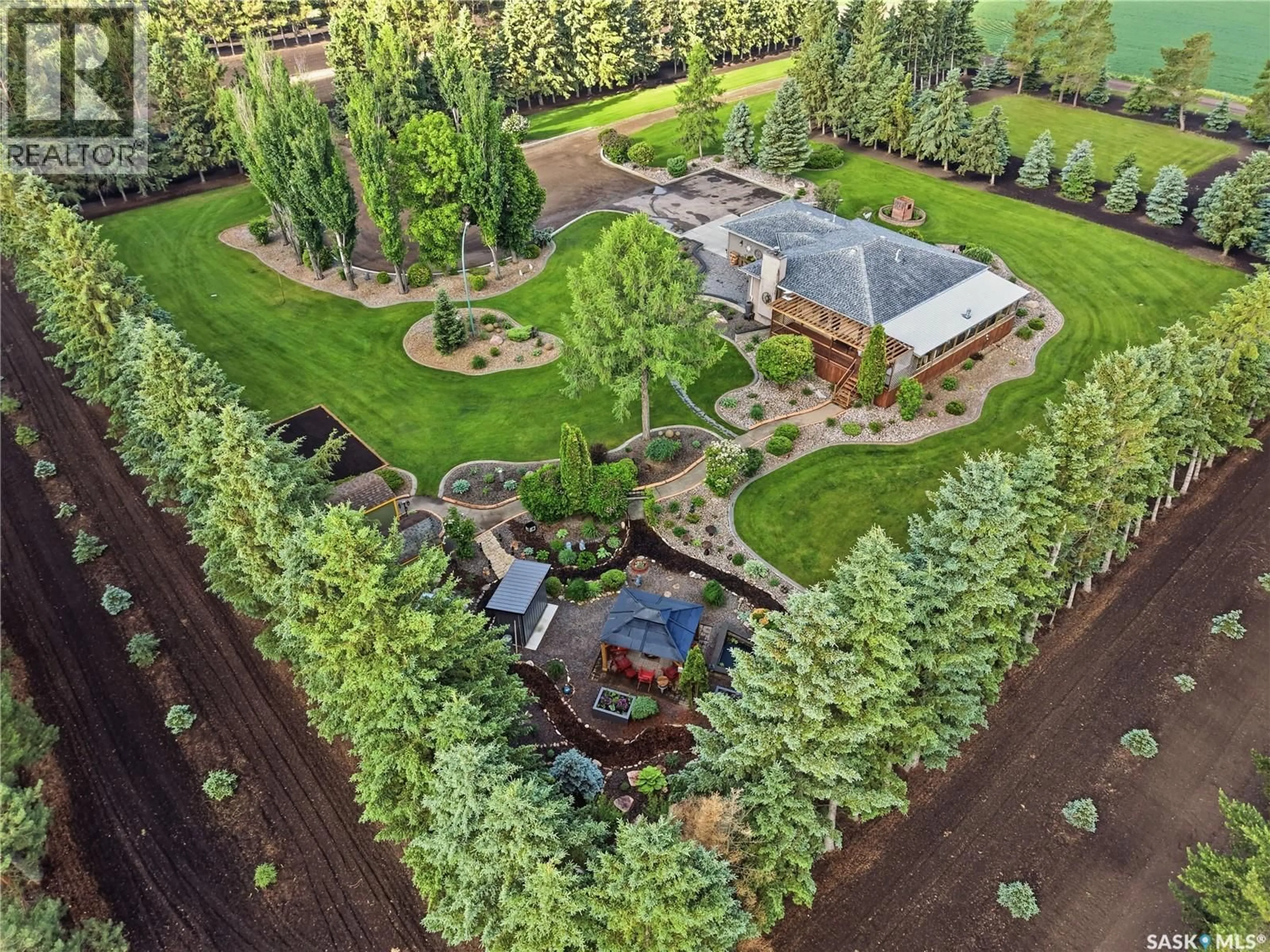 A pic from outside/outdoor area/front of a property/back of a property/a pic from drone, forest/trees view for HEIDEL ACREAGE, North Battleford Rm No. 437 Saskatchewan S9A3W2