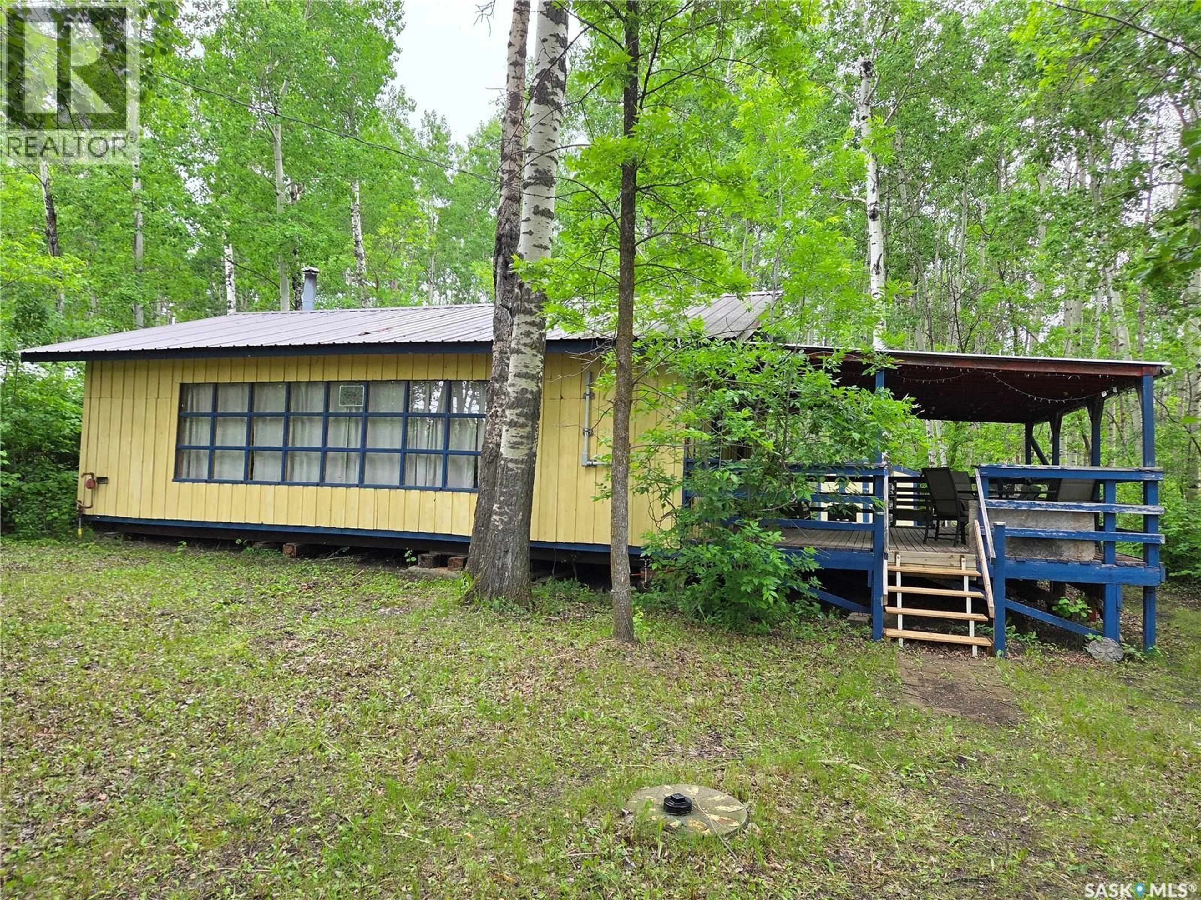 A pic from outside/outdoor area/front of a property/back of a property/a pic from drone, forest/trees view for 313 KAKAKAWAY PLACE, White Bear IR 70 Saskatchewan S0C2S0