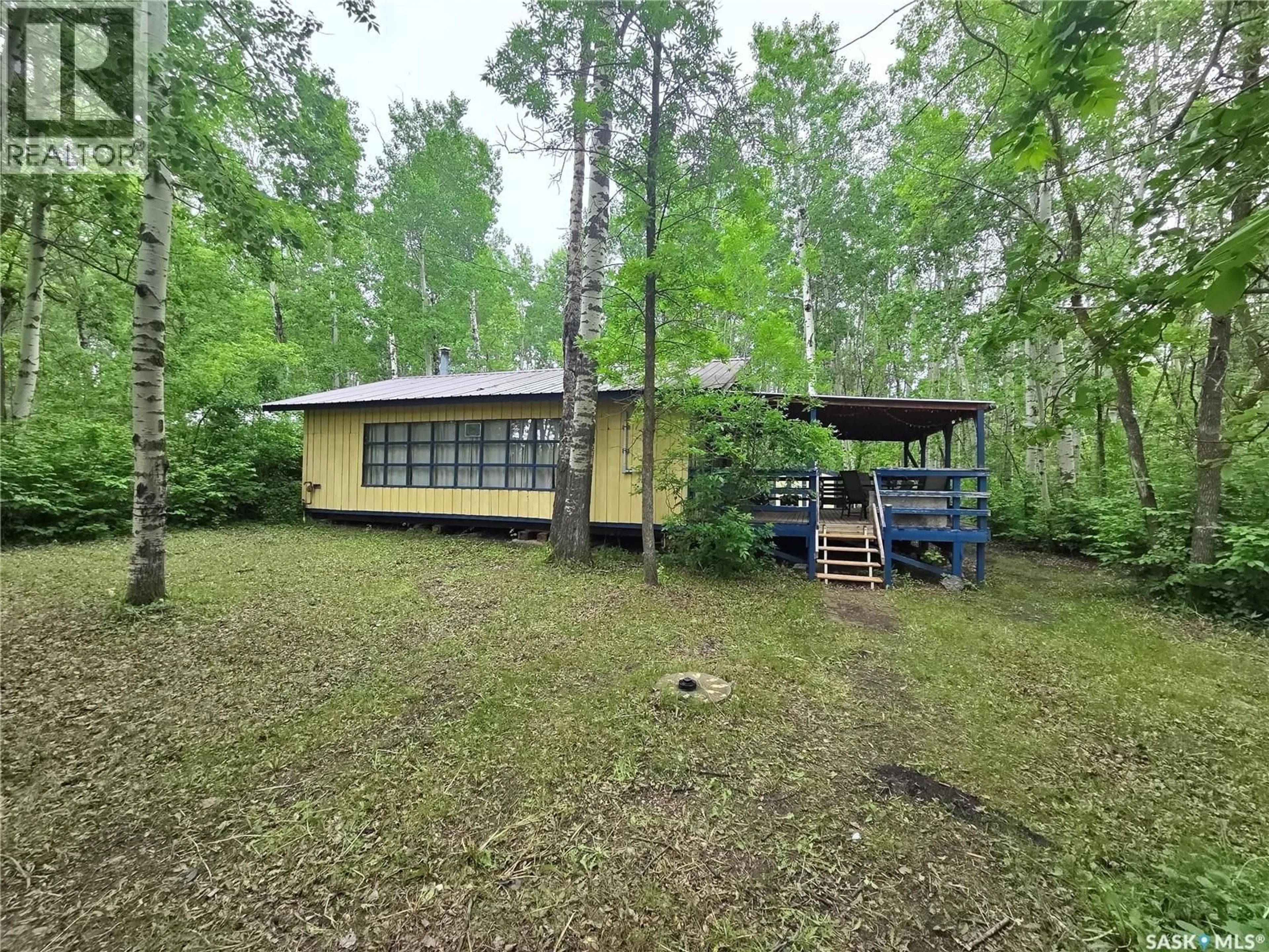 A pic from outside/outdoor area/front of a property/back of a property/a pic from drone, forest/trees view for 313 KAKAKAWAY PLACE, White Bear IR 70 Saskatchewan S0C2S0