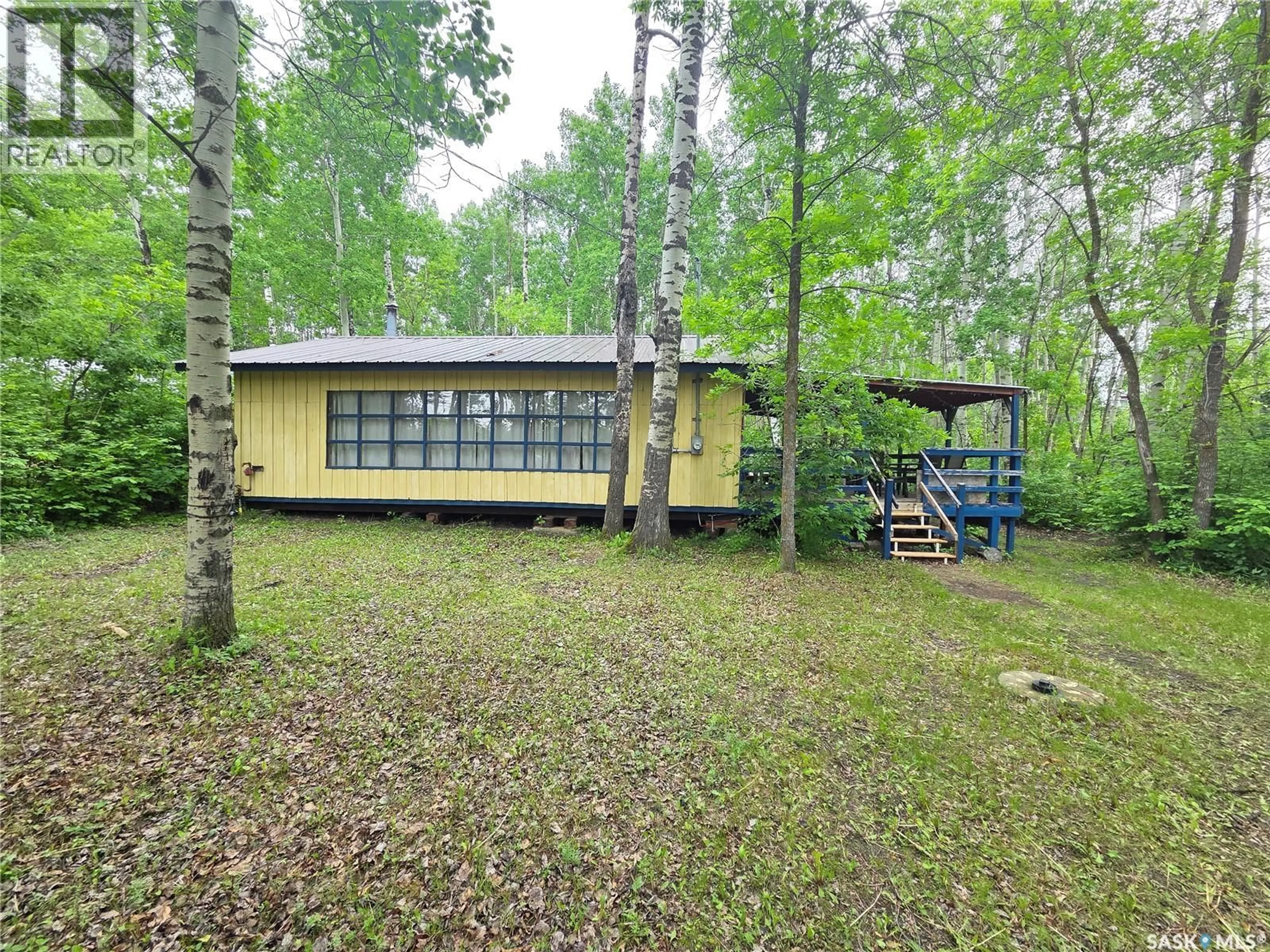 A pic from outside/outdoor area/front of a property/back of a property/a pic from drone, forest/trees view for 313 KAKAKAWAY PLACE, White Bear IR 70 Saskatchewan S0C2S0