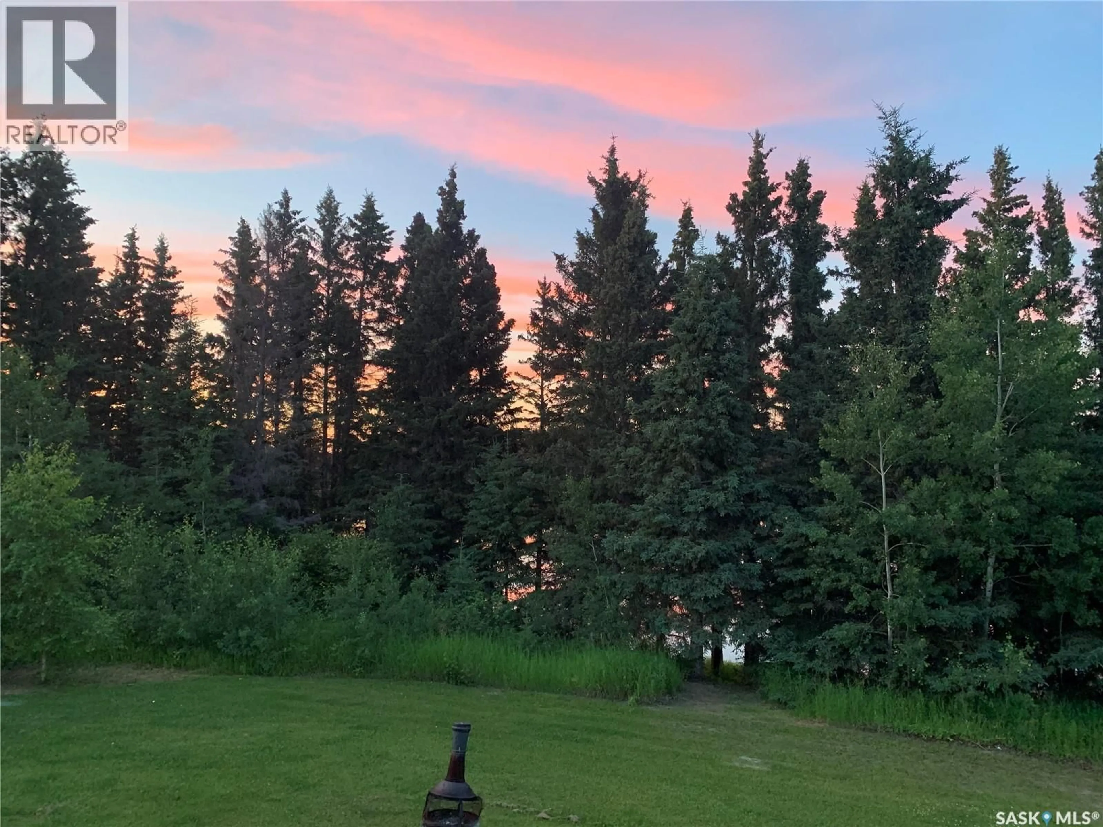 A pic from outside/outdoor area/front of a property/back of a property/a pic from drone, forest/trees view for 13 JENSEN BAY, Fish Lake Saskatchewan S0J0K0
