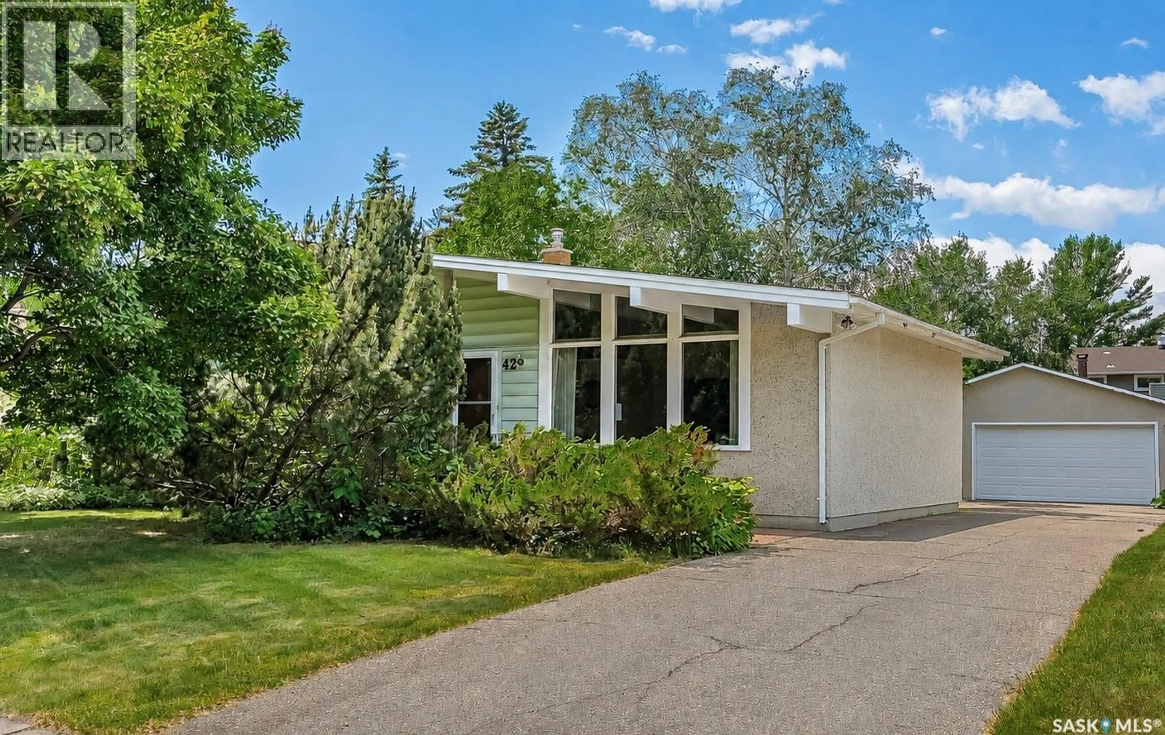 Home with vinyl exterior material, street for 42 NEILSON CRESCENT, Saskatoon Saskatchewan S4R7R2