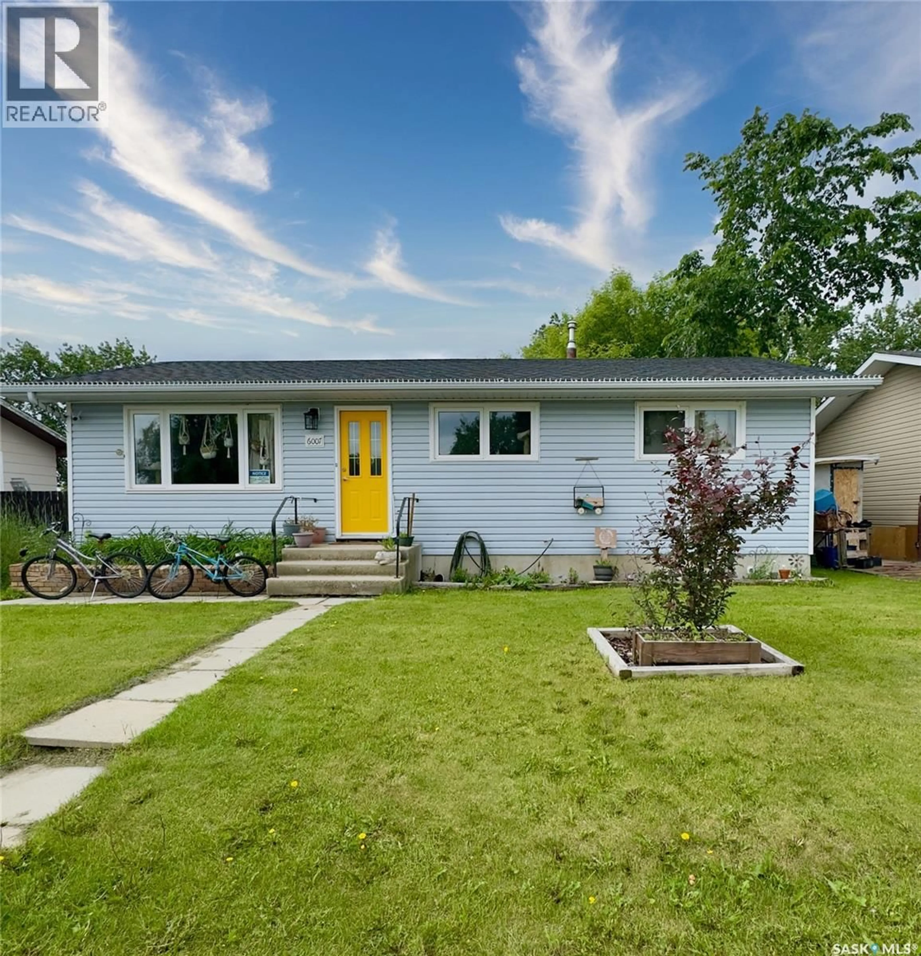 Home with vinyl exterior material, street for 6007 NEUFELD AVENUE, Waldheim Saskatchewan S0K4R0