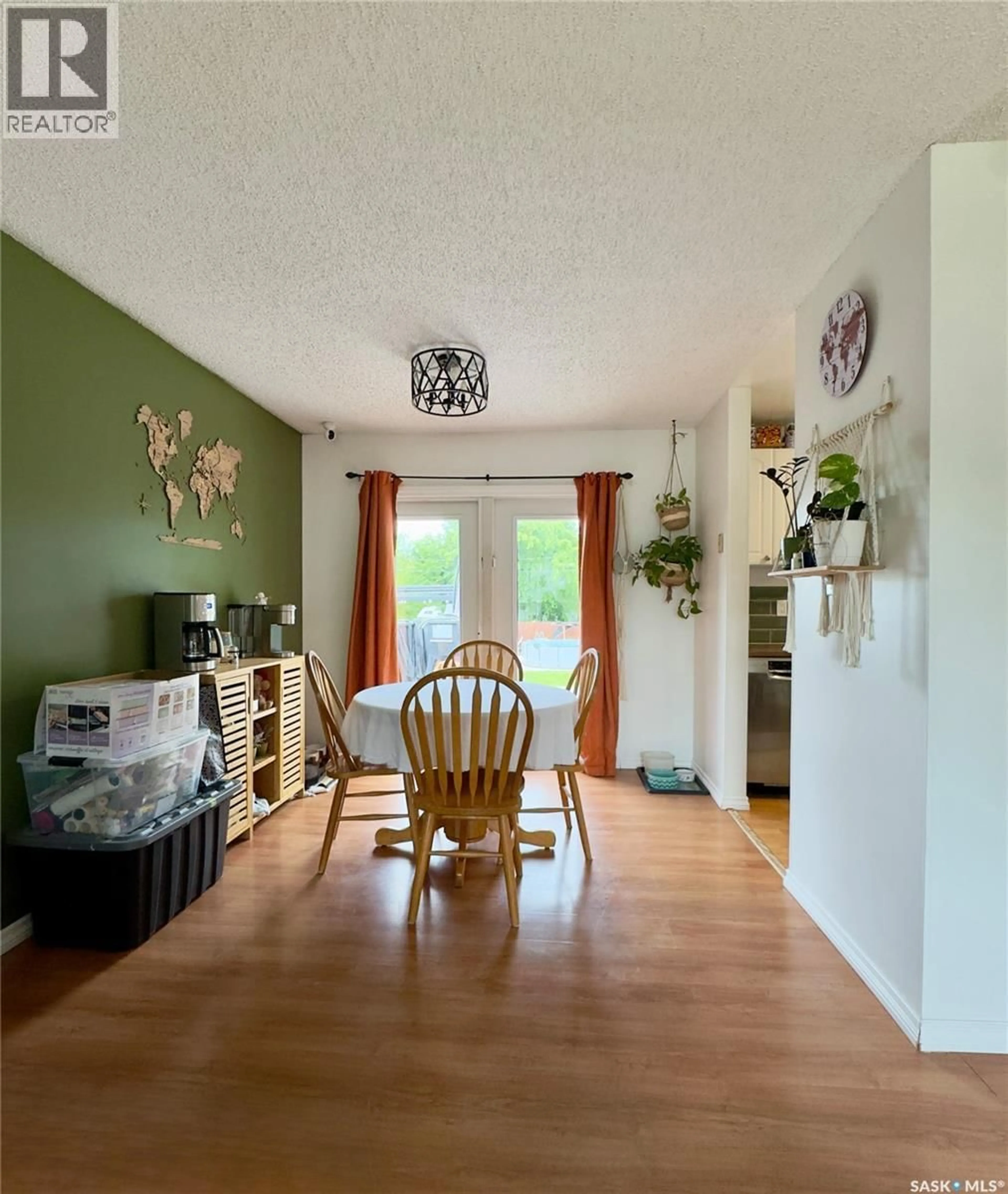 Living room with furniture, wood/laminate floor for 6007 NEUFELD AVENUE, Waldheim Saskatchewan S0K4R0