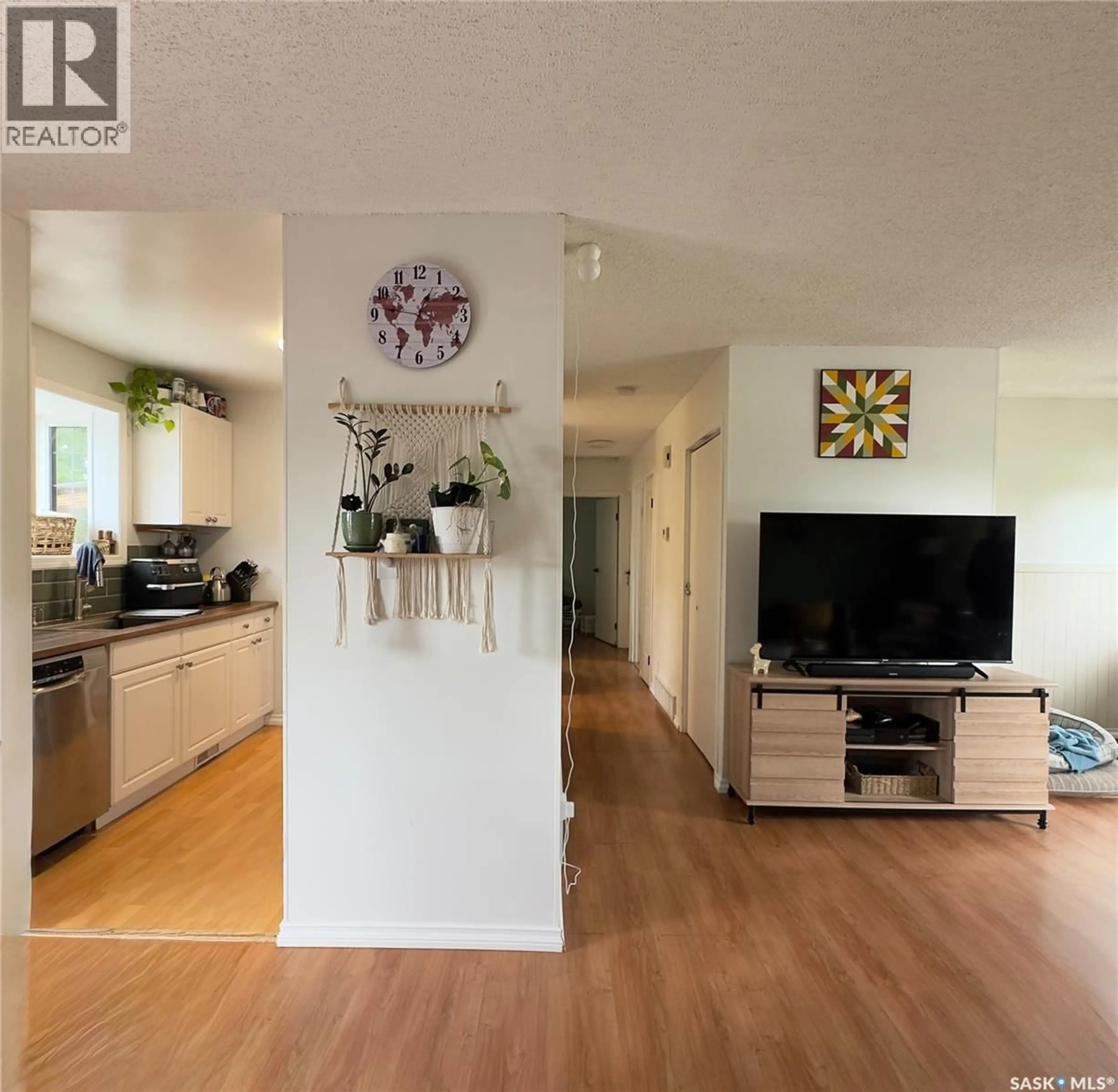 Open concept kitchen, wood/laminate floor for 6007 NEUFELD AVENUE, Waldheim Saskatchewan S0K4R0
