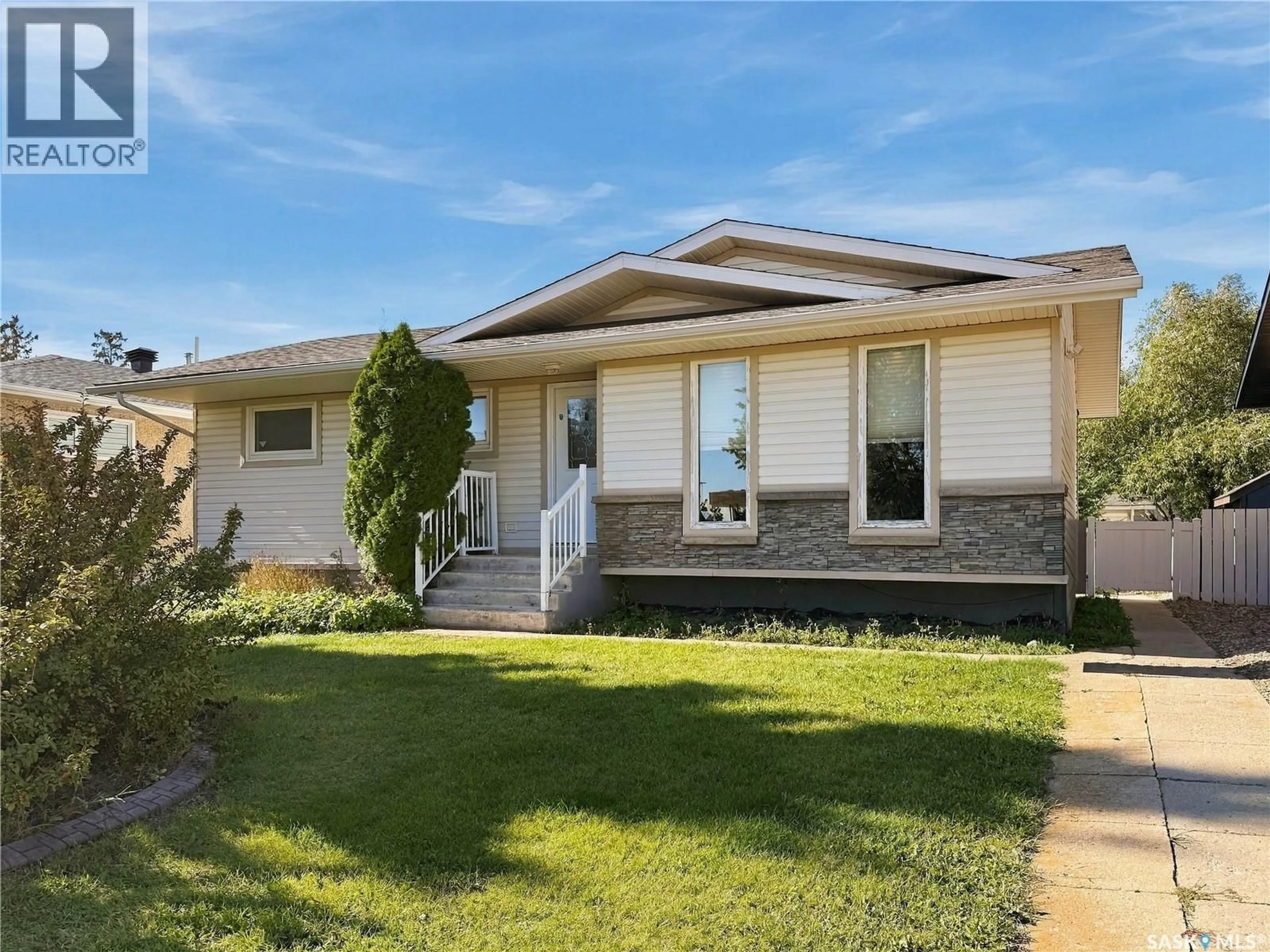 Home with vinyl exterior material, street for 2011 102ND STREET, North Battleford Saskatchewan S9A1H8