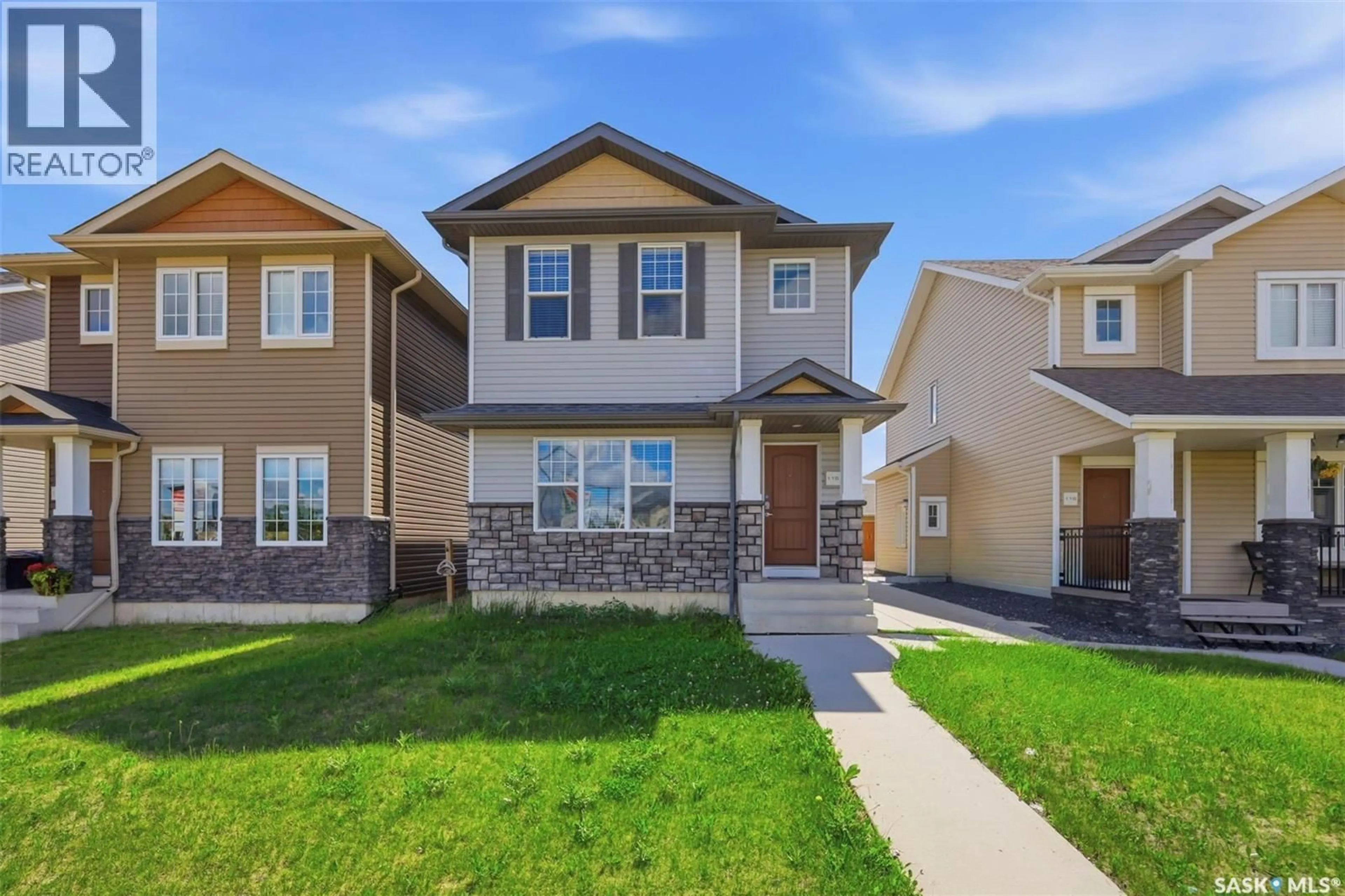 Home with vinyl exterior material, street for 115 TWEED LANE, Saskatoon Saskatchewan S7V0K1
