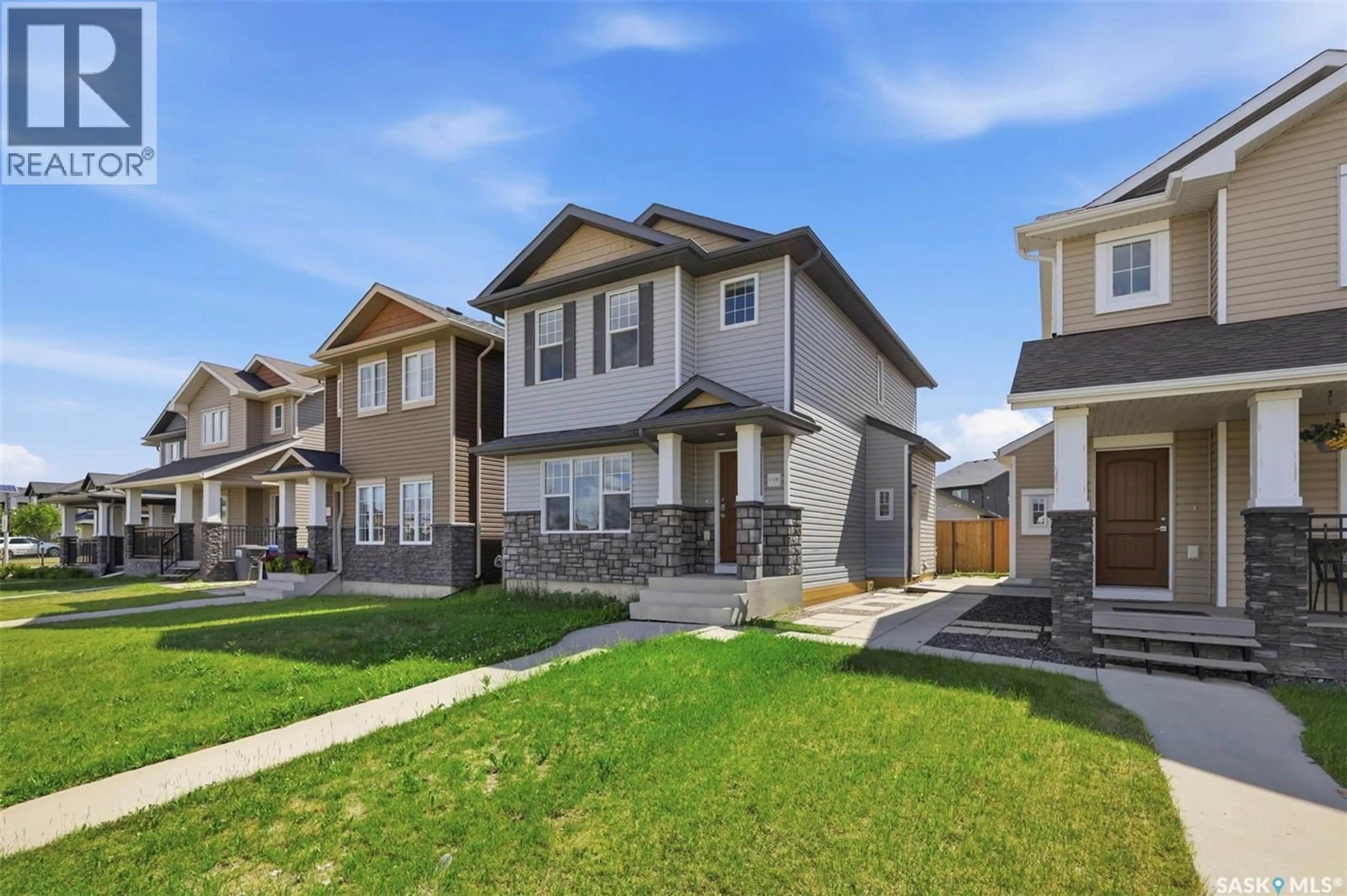 Home with vinyl exterior material, street for 115 TWEED LANE, Saskatoon Saskatchewan S7V0K1