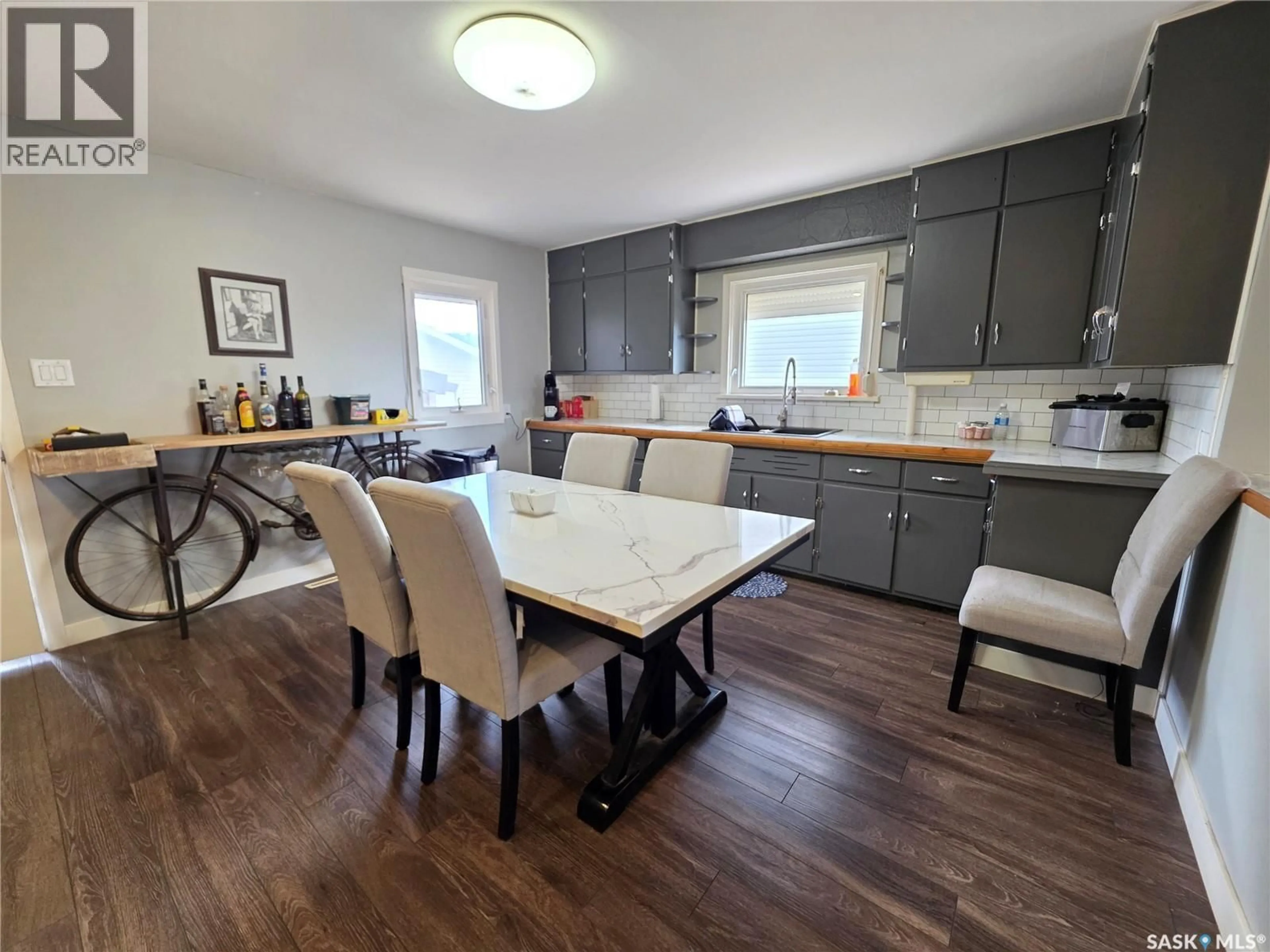 Open concept kitchen, wood/laminate floor for 227 10TH AVENUE, Swift Current Saskatchewan S9H1B4