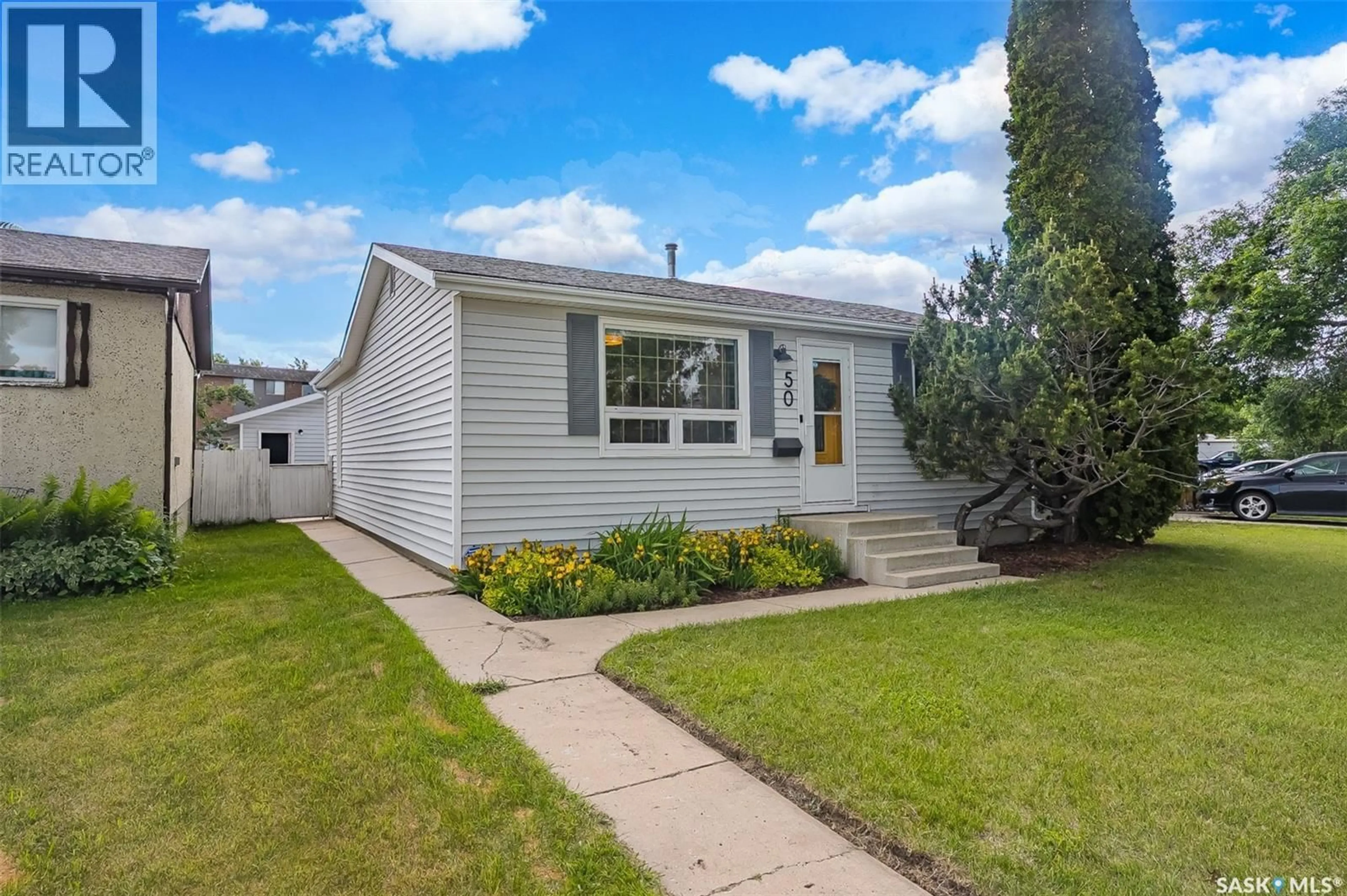 Home with vinyl exterior material, street for 50 MATHESON PLACE, Saskatoon Saskatchewan S7L3Y5