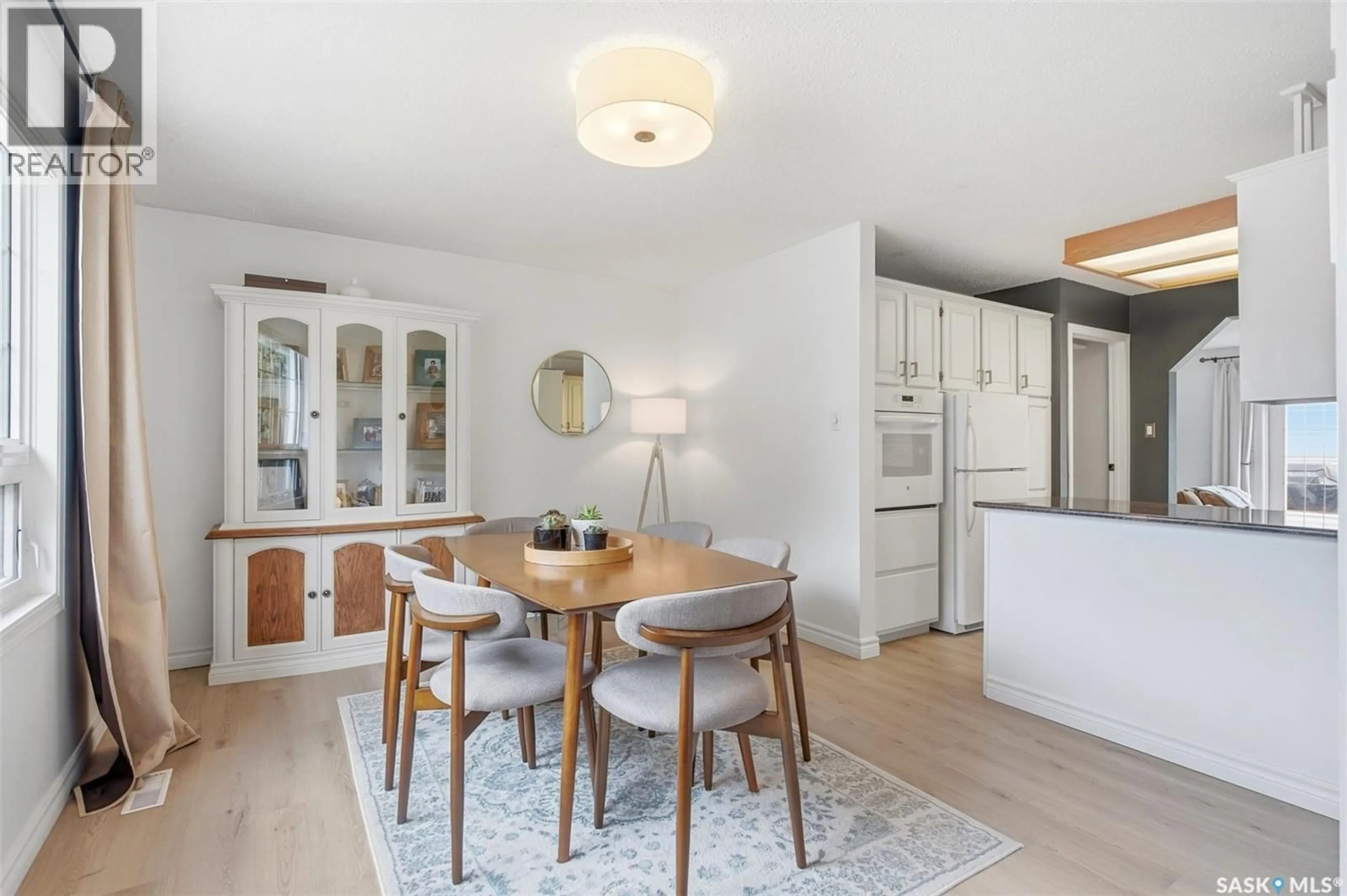 Open concept kitchen, wood/laminate floor for 50 MATHESON PLACE, Saskatoon Saskatchewan S7L3Y5