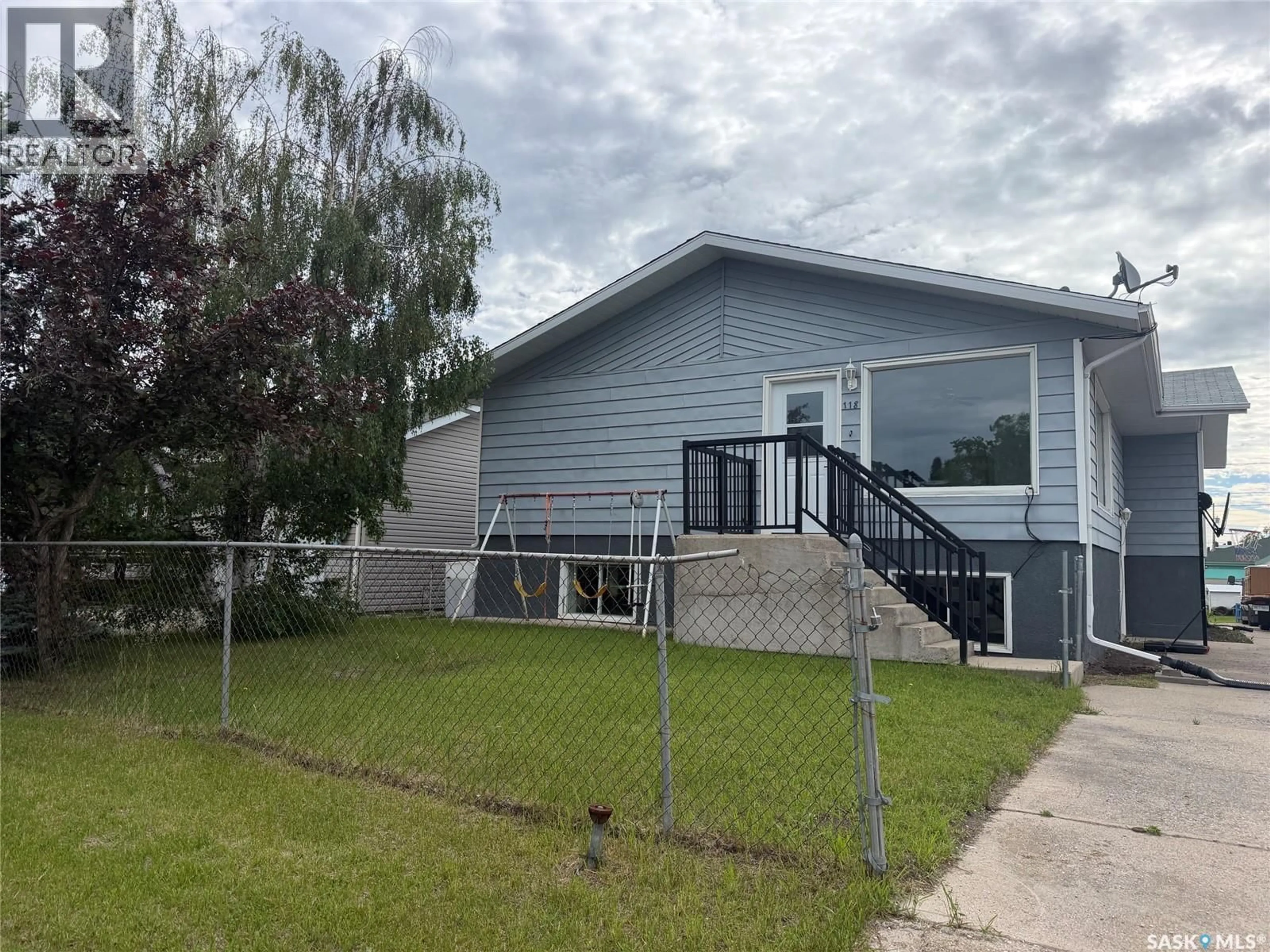 Home with vinyl exterior material, street for 118 HUDSON STREET, Hudson Bay Saskatchewan S0E0Y0