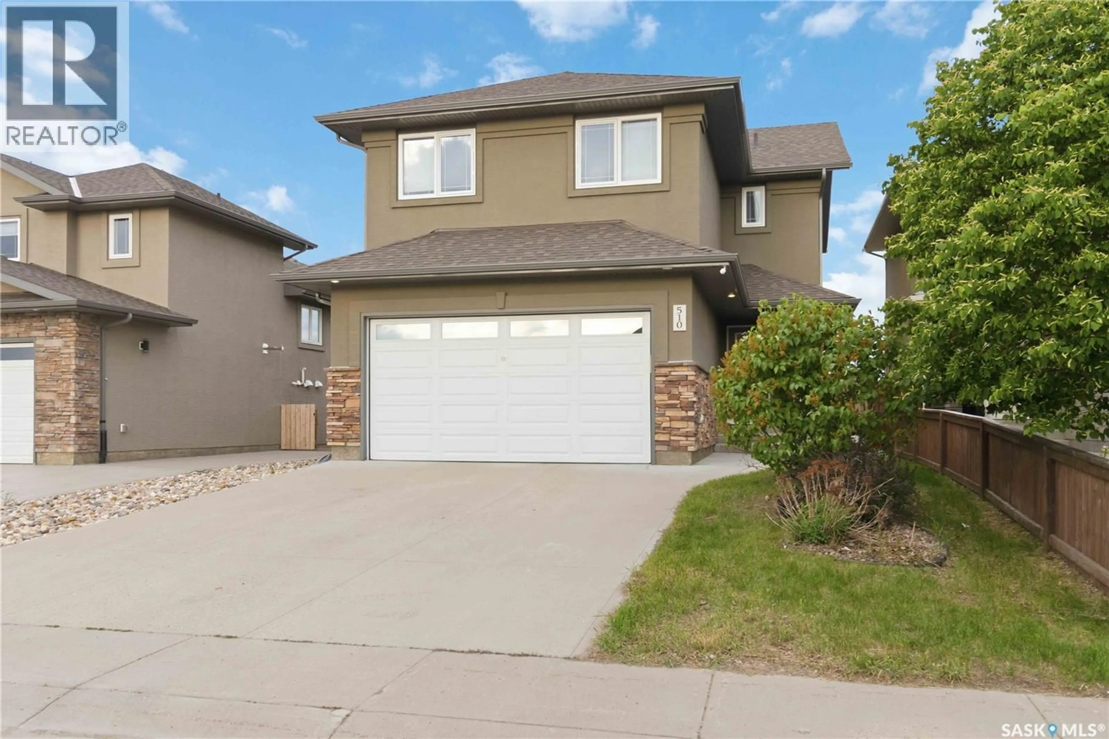 Home with vinyl exterior material, street for 510 SUTTER CRESCENT, Saskatoon Saskatchewan S7T0R4