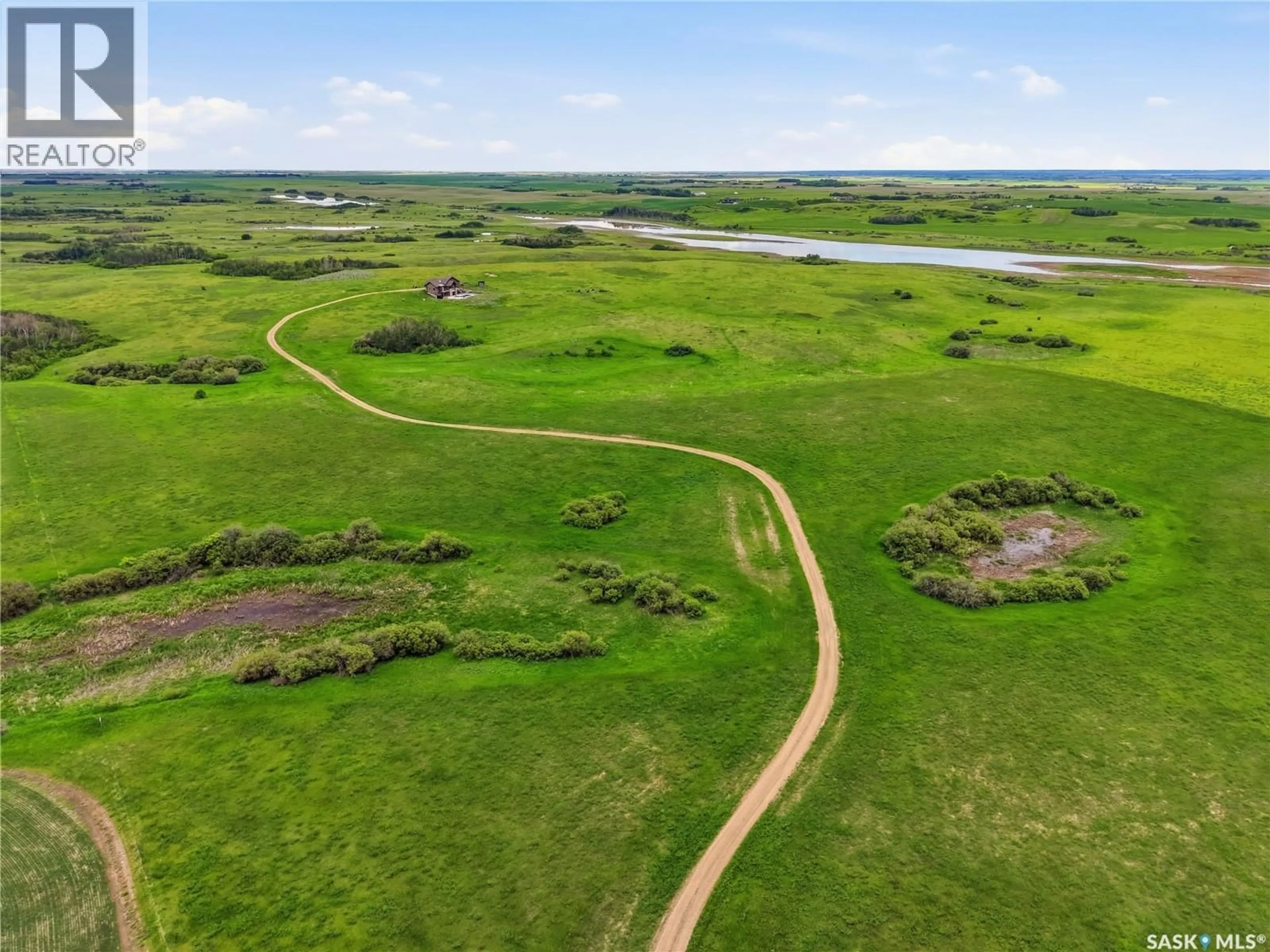 A pic from outside/outdoor area/front of a property/back of a property/a pic from drone, water/lake/river/ocean view for BRADSHAW ACREAGE, Blucher Rm No. 343 Saskatchewan S0K0P0