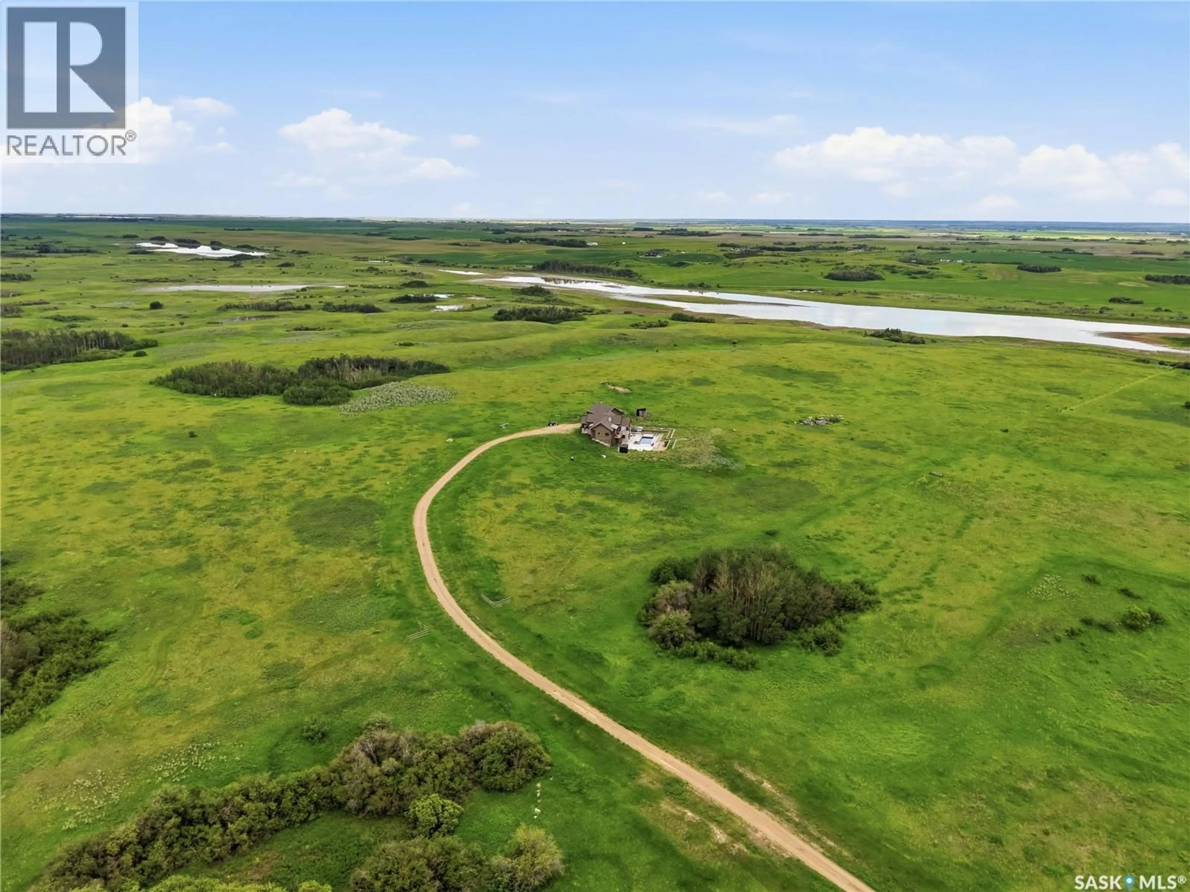 A pic from outside/outdoor area/front of a property/back of a property/a pic from drone, water/lake/river/ocean view for BRADSHAW ACREAGE, Blucher Rm No. 343 Saskatchewan S0K0P0