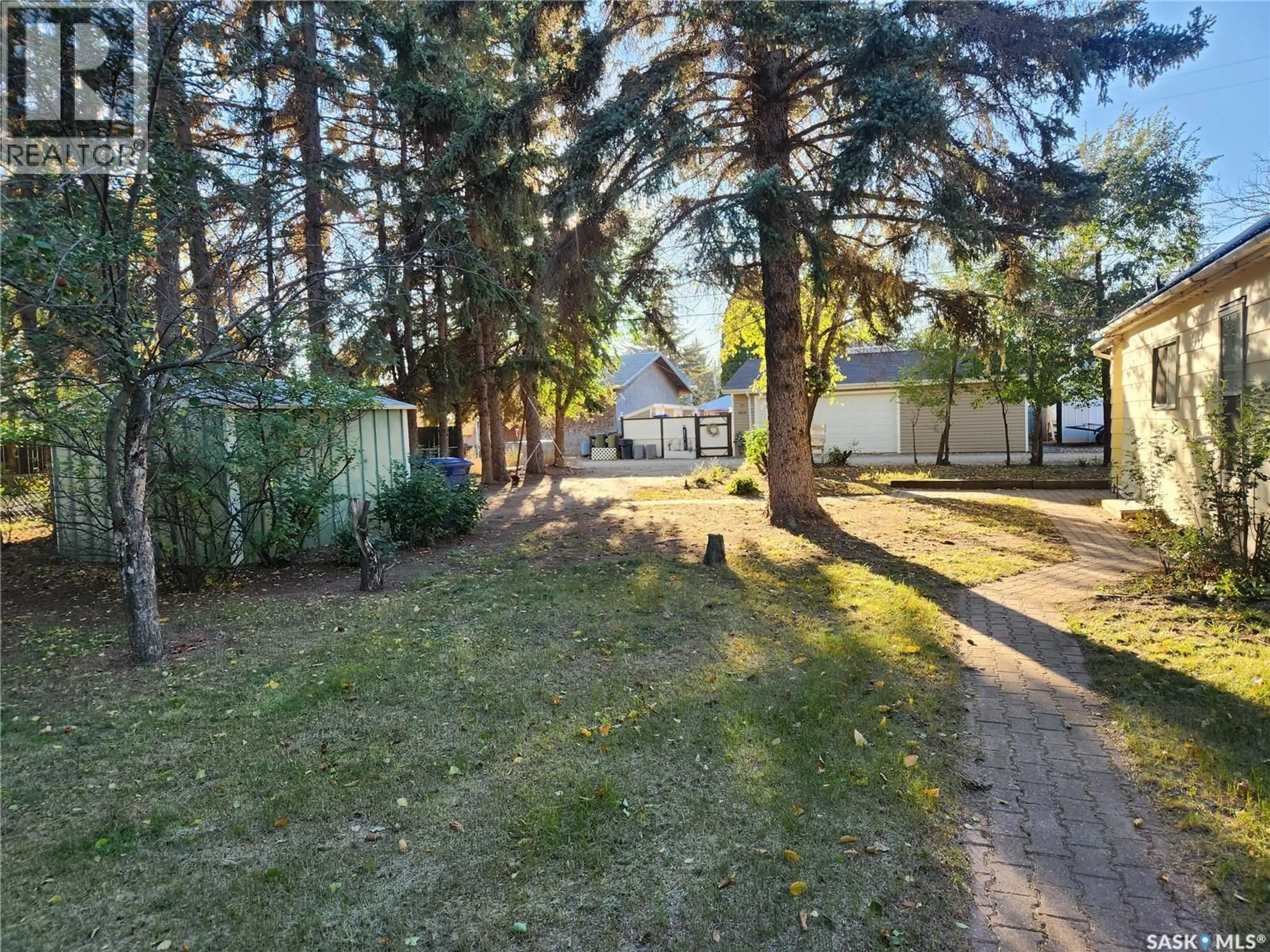 A pic from outside/outdoor area/front of a property/back of a property/a pic from drone, forest/trees view for 308 PANGMAN STREET, Outlook Saskatchewan S0L2N0