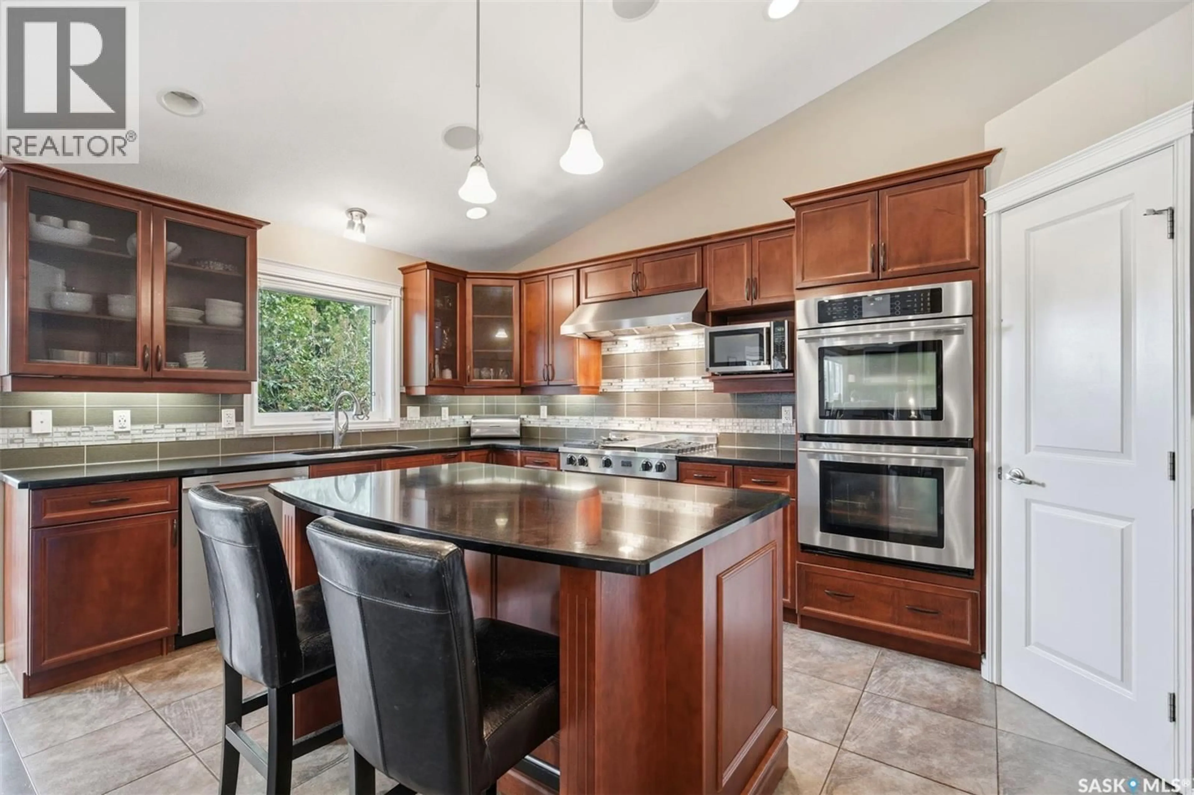 Open concept kitchen, ceramic/tile floor for 310 BORLASE COVE, Saskatoon Saskatchewan S7T0B7