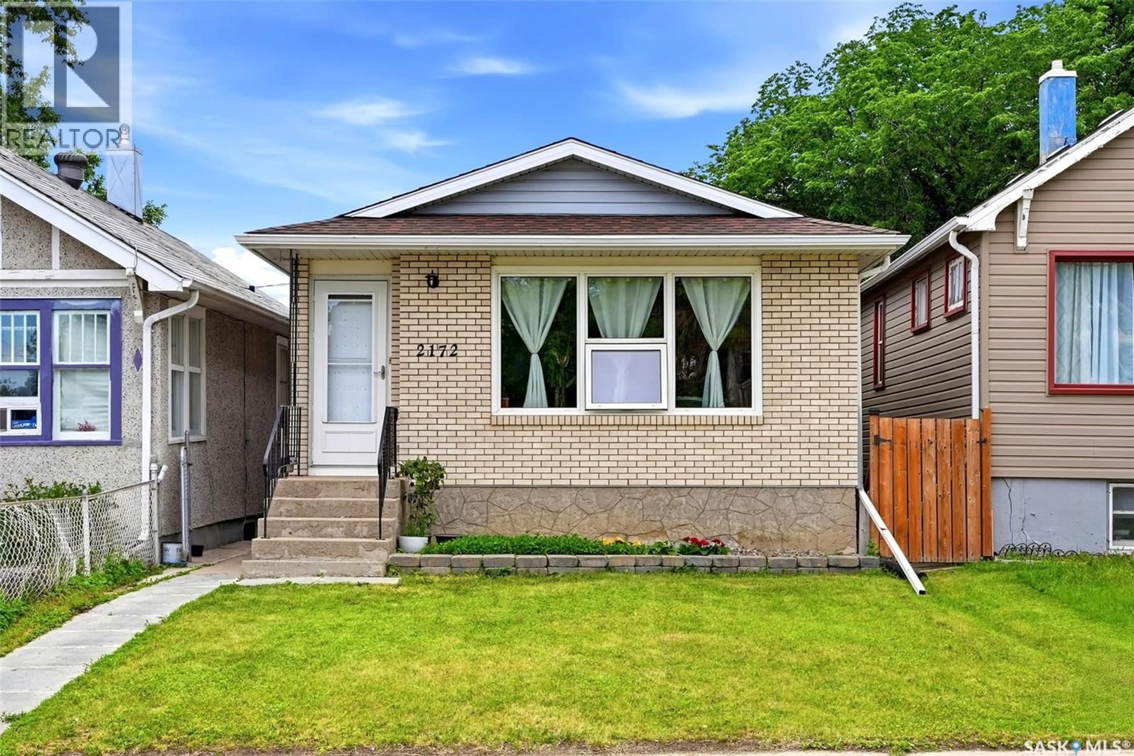 Home with brick exterior material, street for 2172 REYNOLDS STREET, Regina Saskatchewan S4N3N1