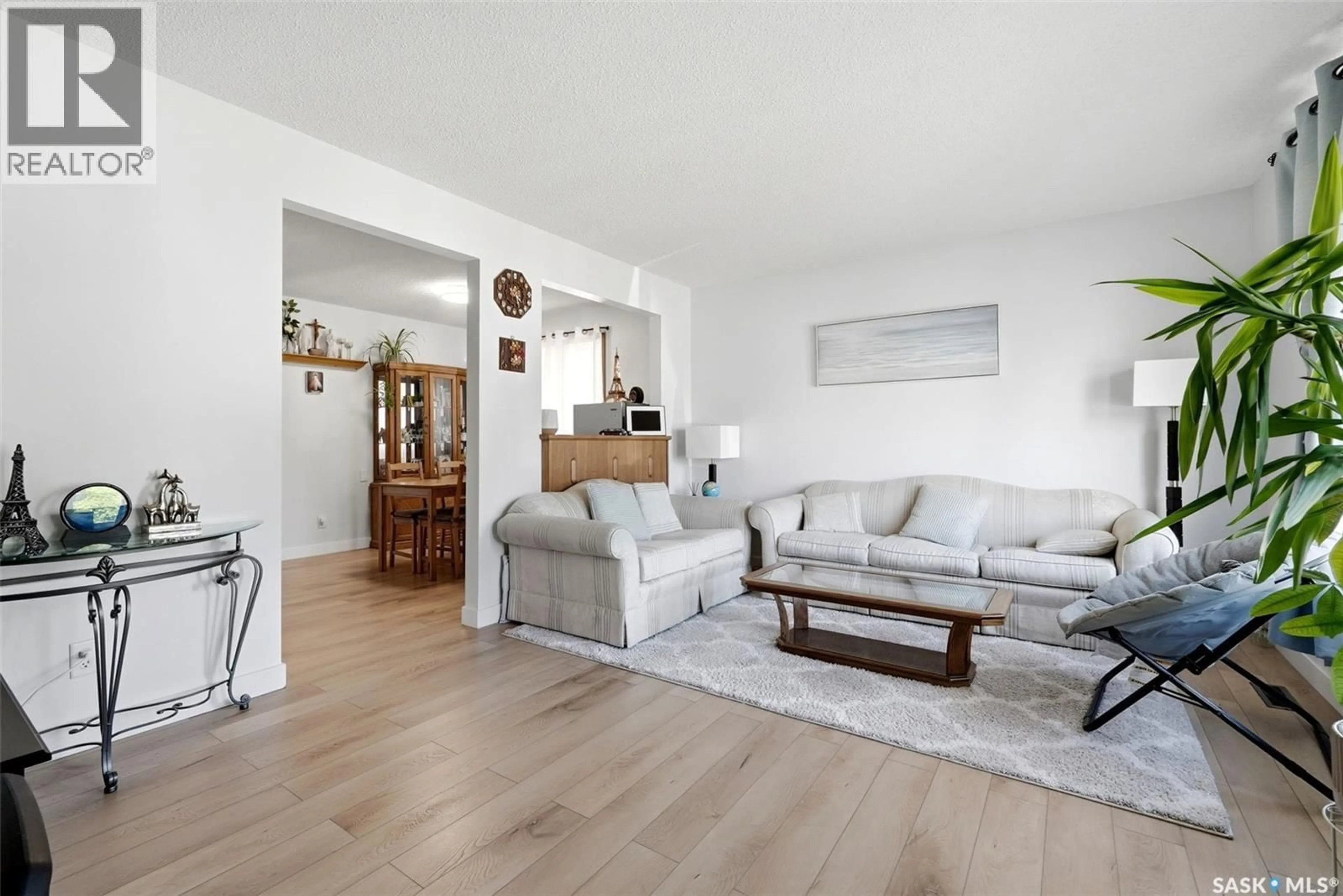 Living room with furniture, wood/laminate floor for 2172 REYNOLDS STREET, Regina Saskatchewan S4N3N1