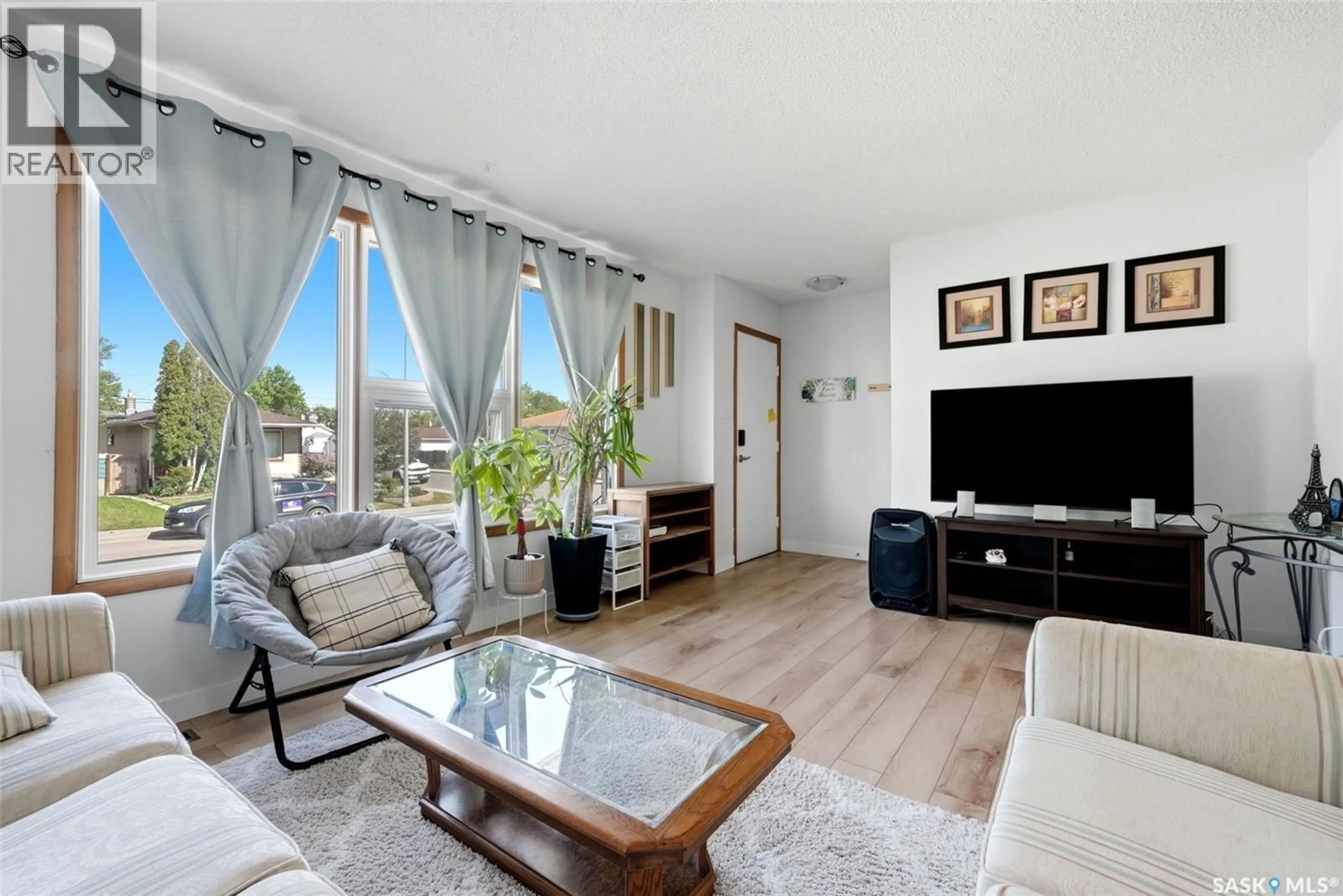 Living room with furniture, wood/laminate floor for 2172 REYNOLDS STREET, Regina Saskatchewan S4N3N1