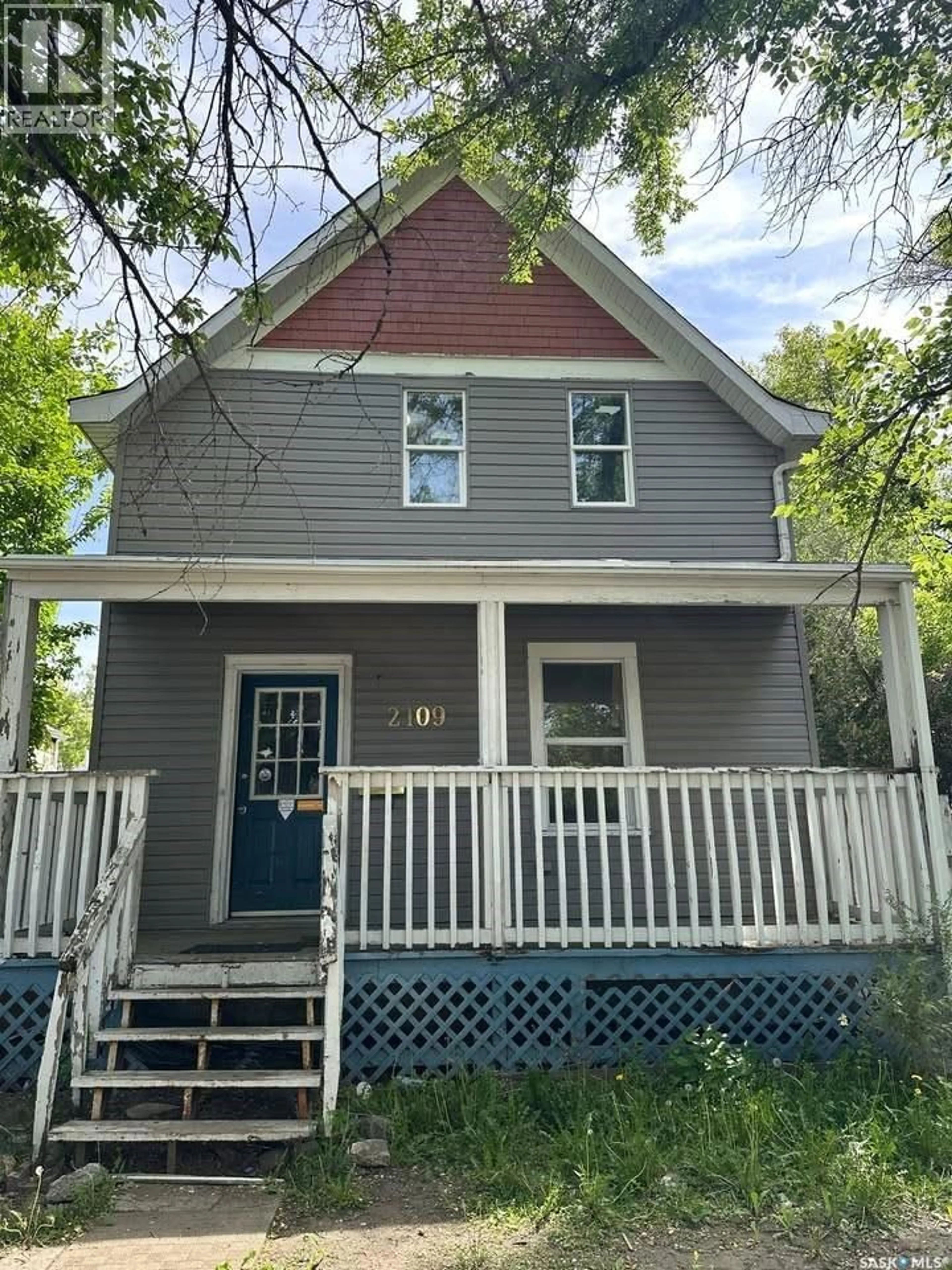Home with vinyl exterior material, street for 2109 20TH STREET, Saskatoon Saskatchewan S7M1A7