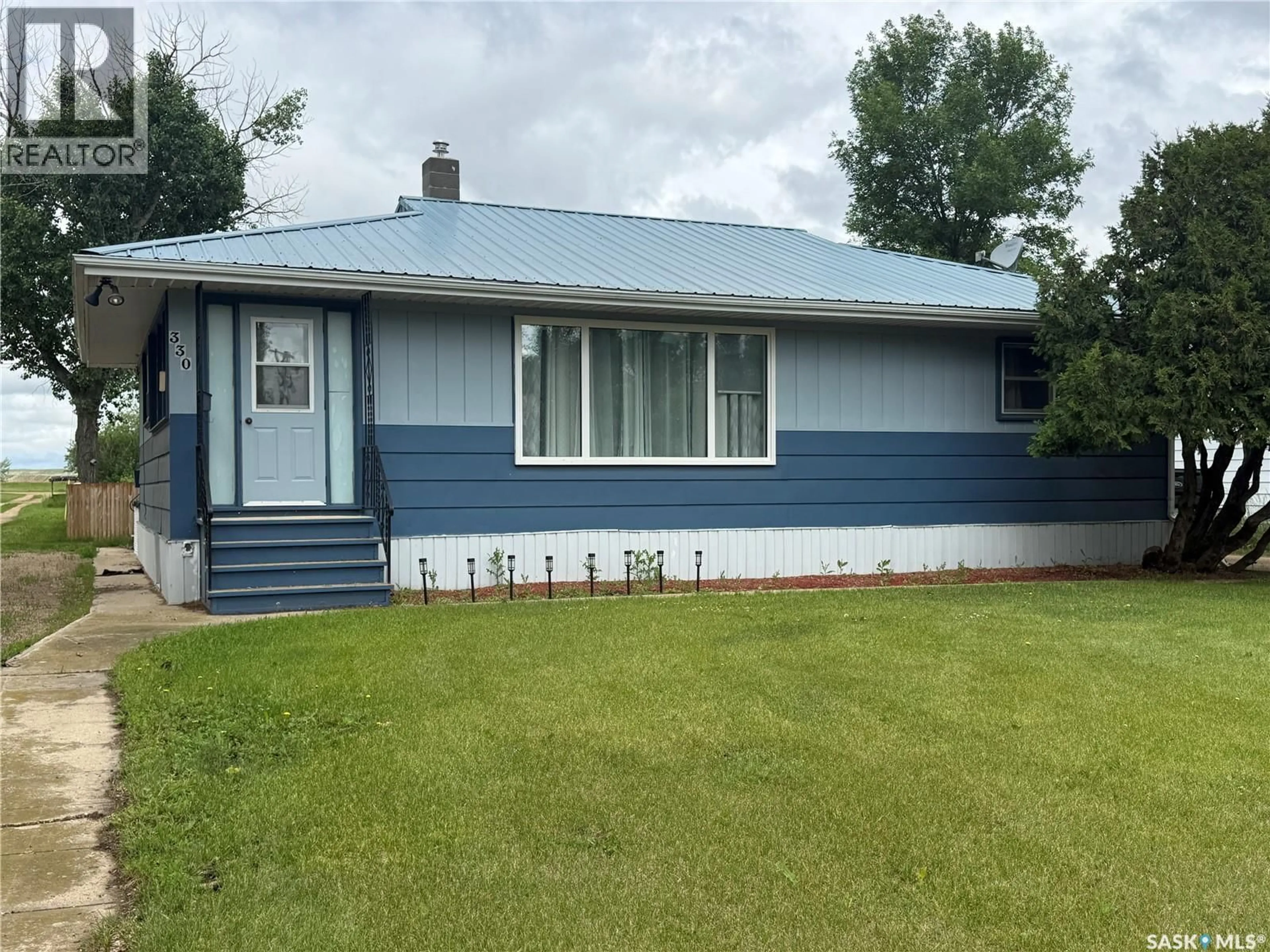 Home with vinyl exterior material, street for 330 FERGUSON STREET, Craik Saskatchewan S0G0V0