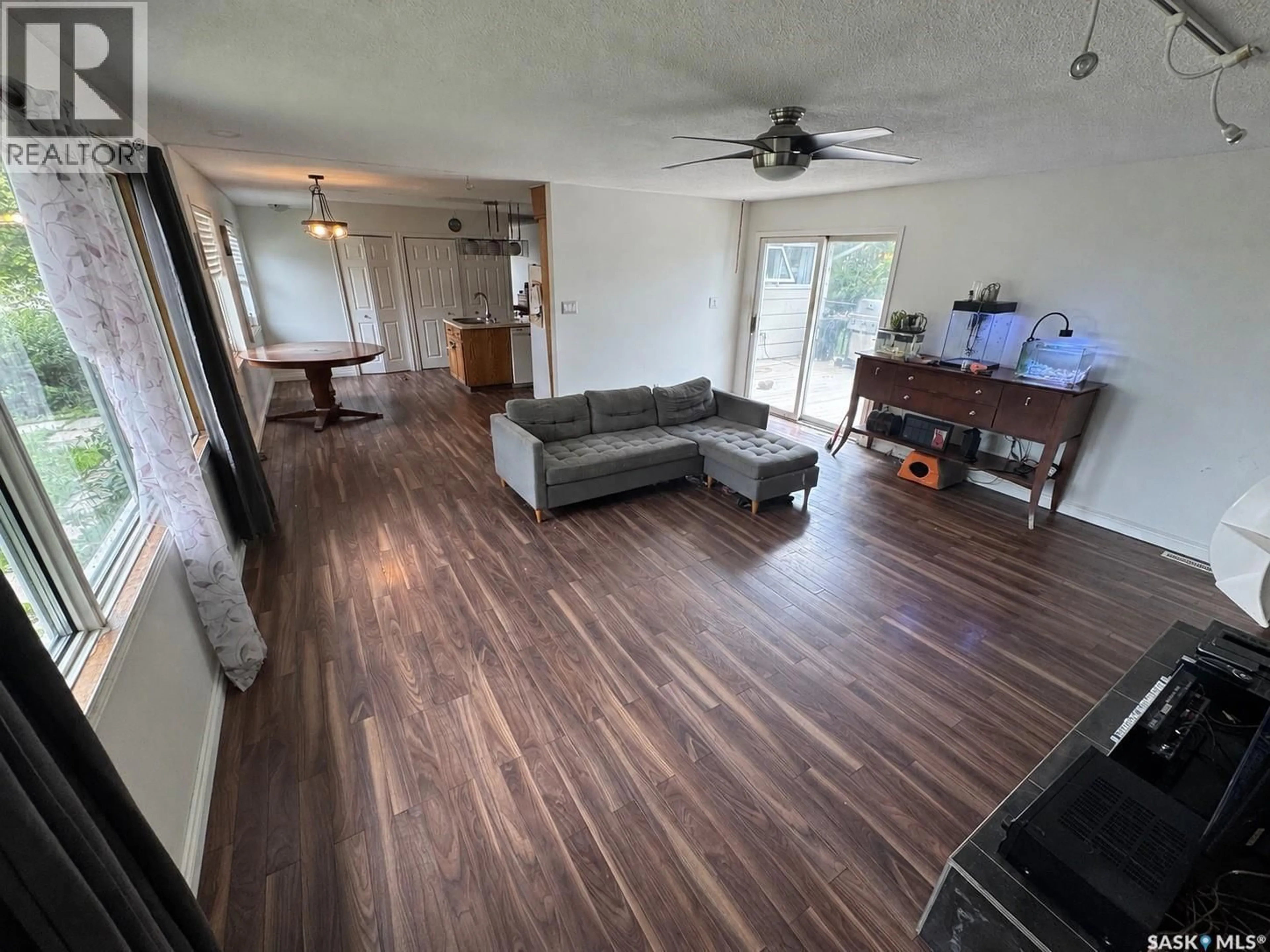Living room with furniture, wood/laminate floor for 106 DOWNEY STREET, Strasbourg Saskatchewan S0G4V0