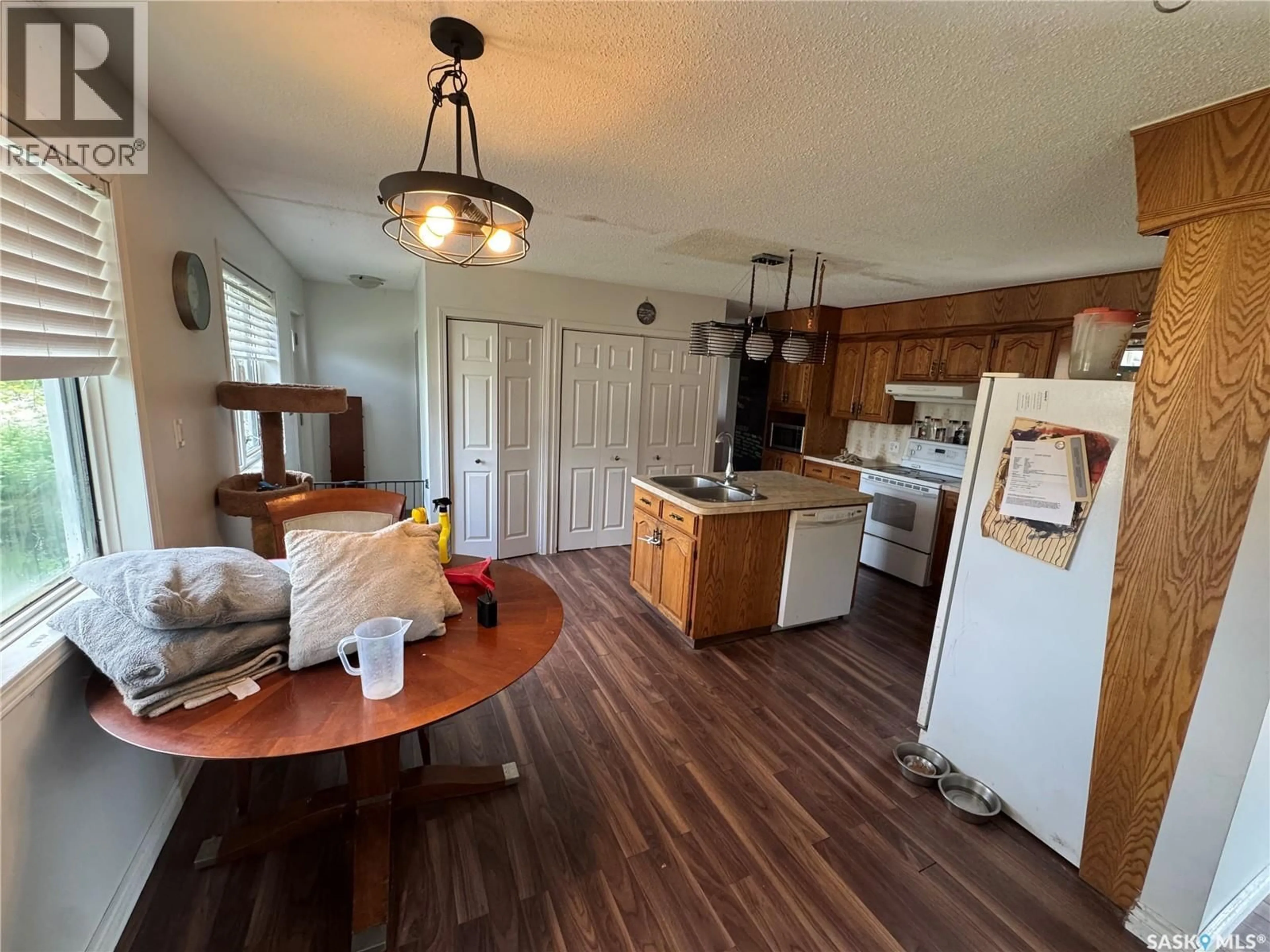 Open concept kitchen, wood/laminate floor for 106 DOWNEY STREET, Strasbourg Saskatchewan S0G4V0