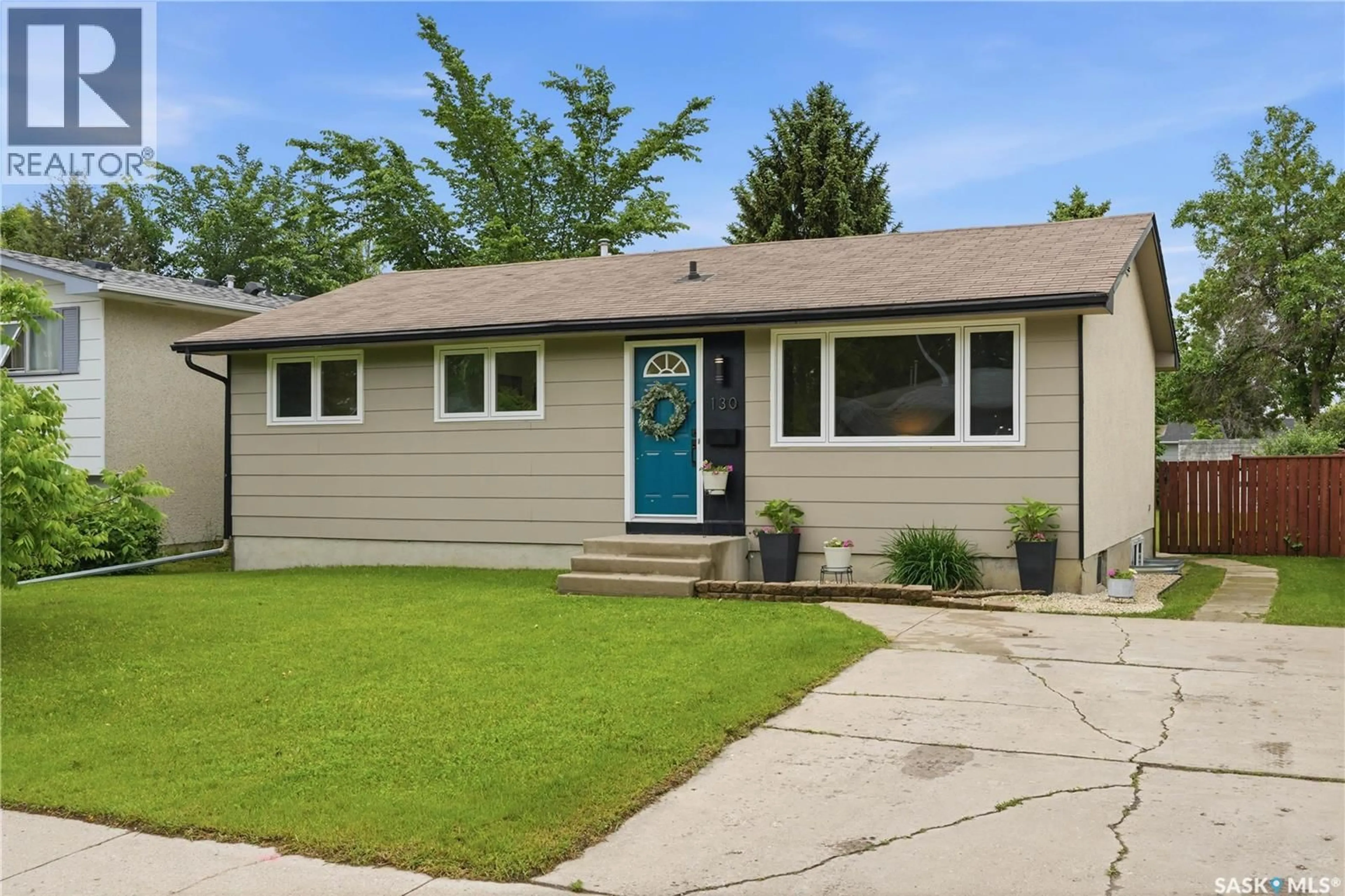 Home with vinyl exterior material, street for 130 BIRCH CRESCENT, Saskatoon Saskatchewan S7N2M3