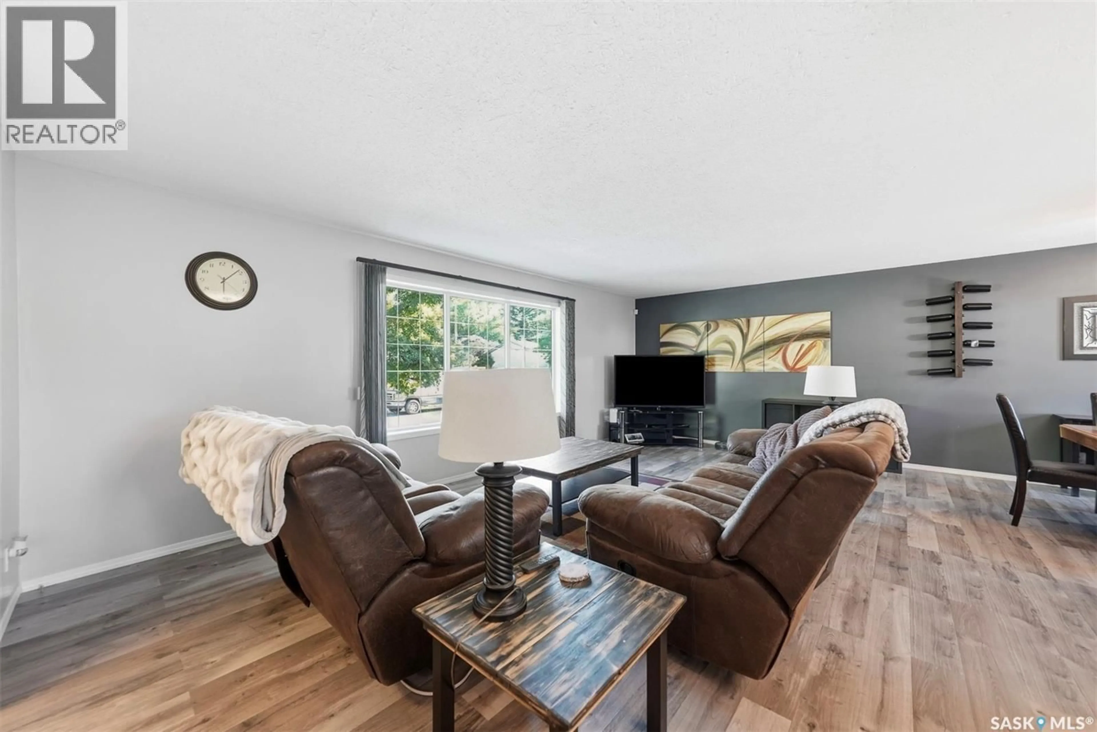 Living room with furniture, wood/laminate floor for 351 Y AVENUE, Saskatoon Saskatchewan S7M3J6