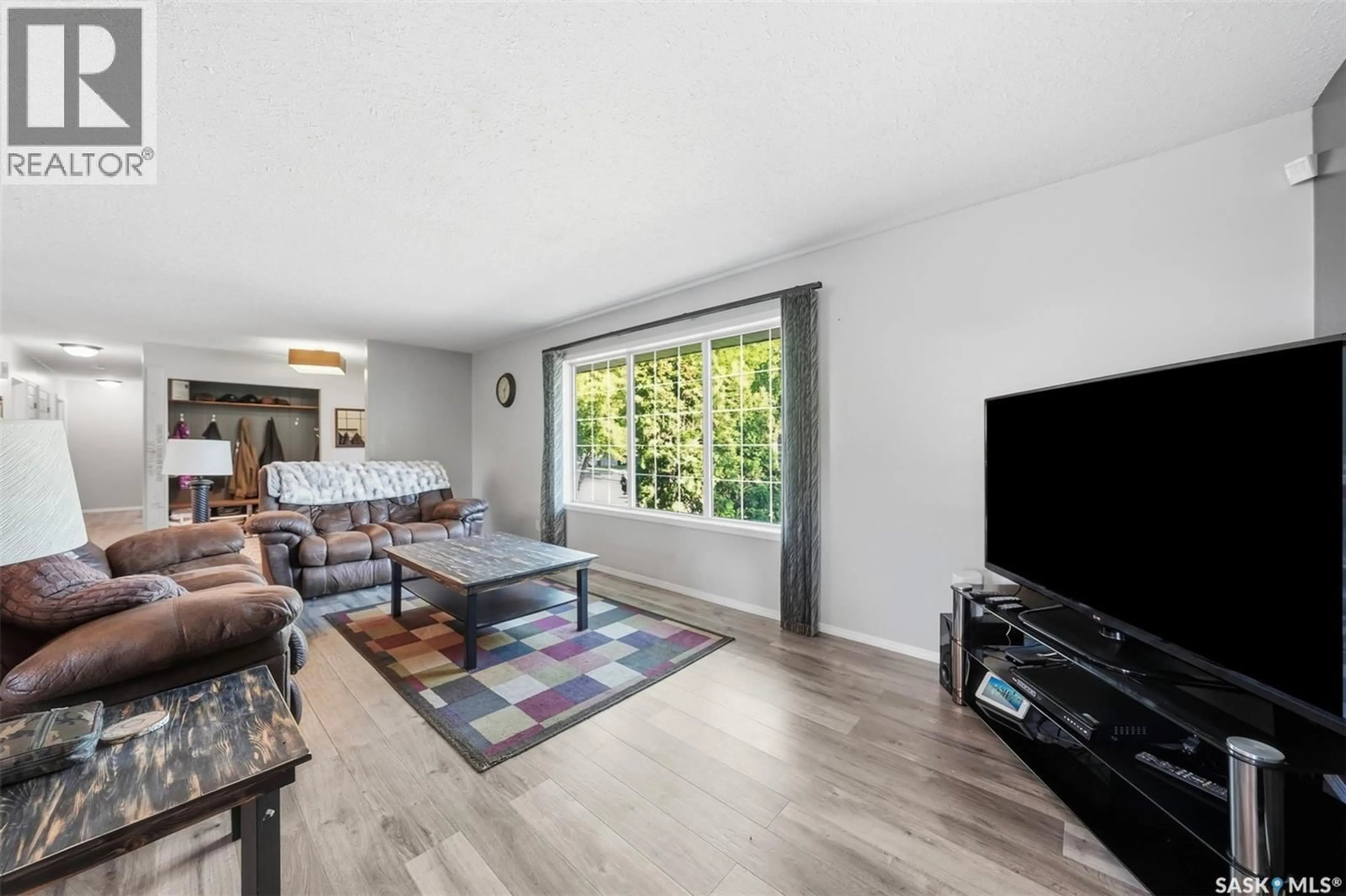Living room with furniture, wood/laminate floor for 351 Y AVENUE, Saskatoon Saskatchewan S7M3J6