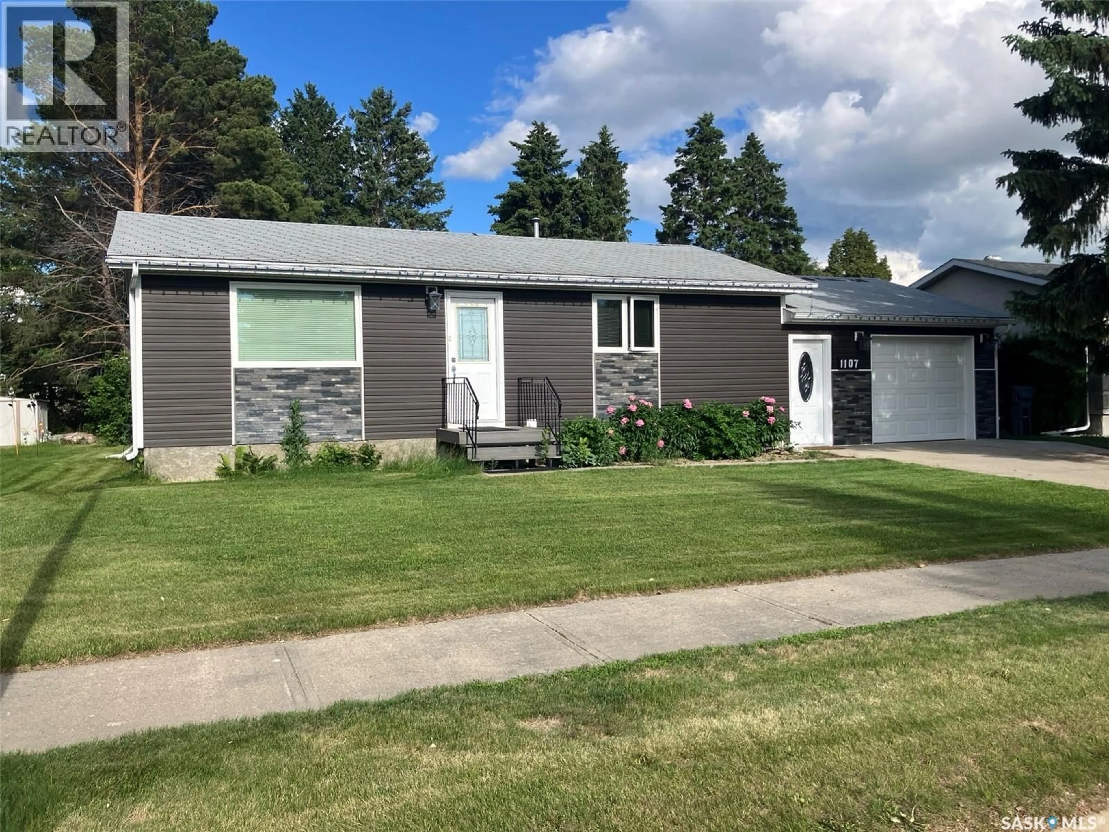 Home with vinyl exterior material, street for 1107 CENTRE STREET, Nipawin Saskatchewan S0E1E0