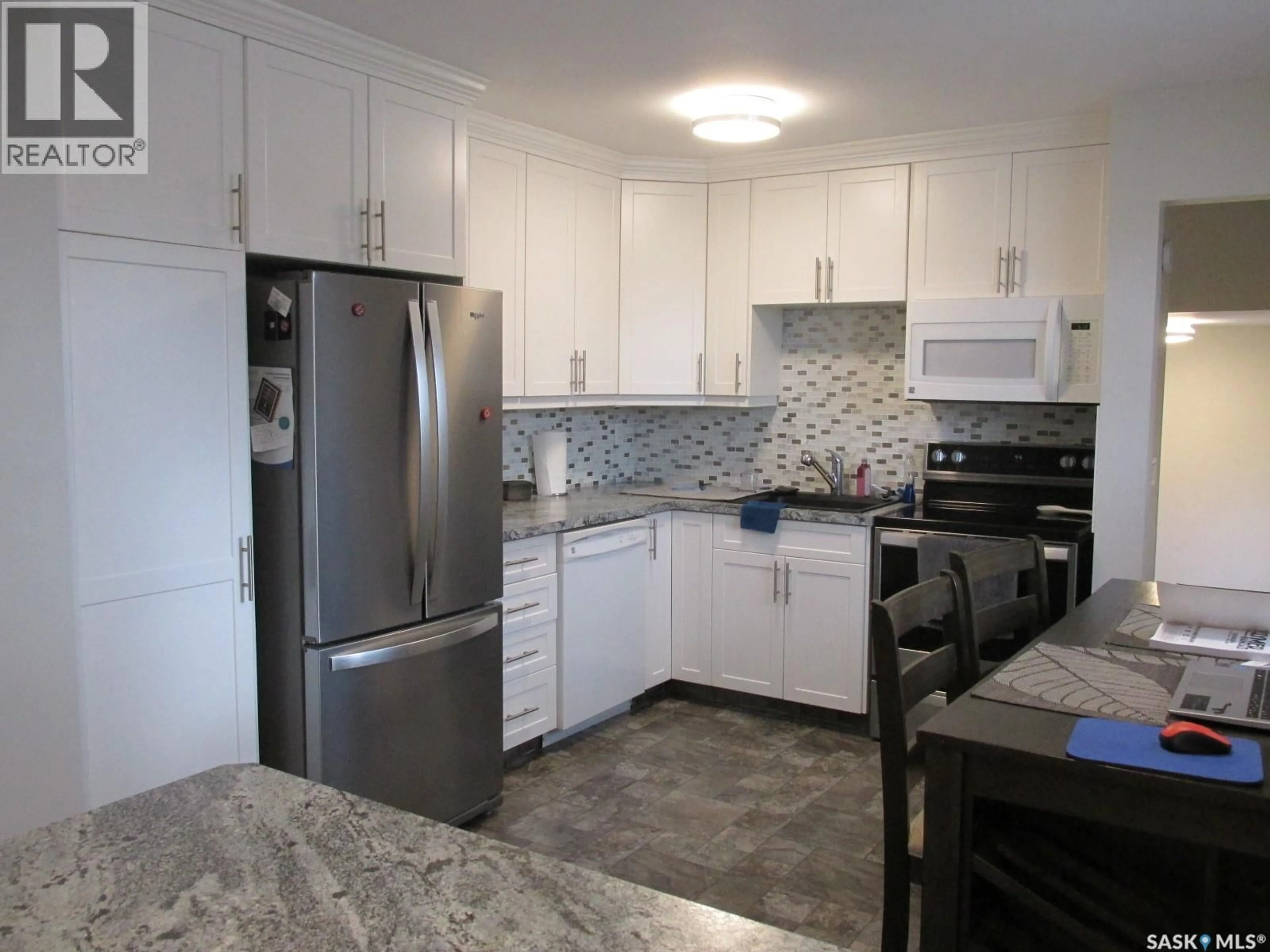 Open concept kitchen, ceramic/tile floor for 1107 CENTRE STREET, Nipawin Saskatchewan S0E1E0