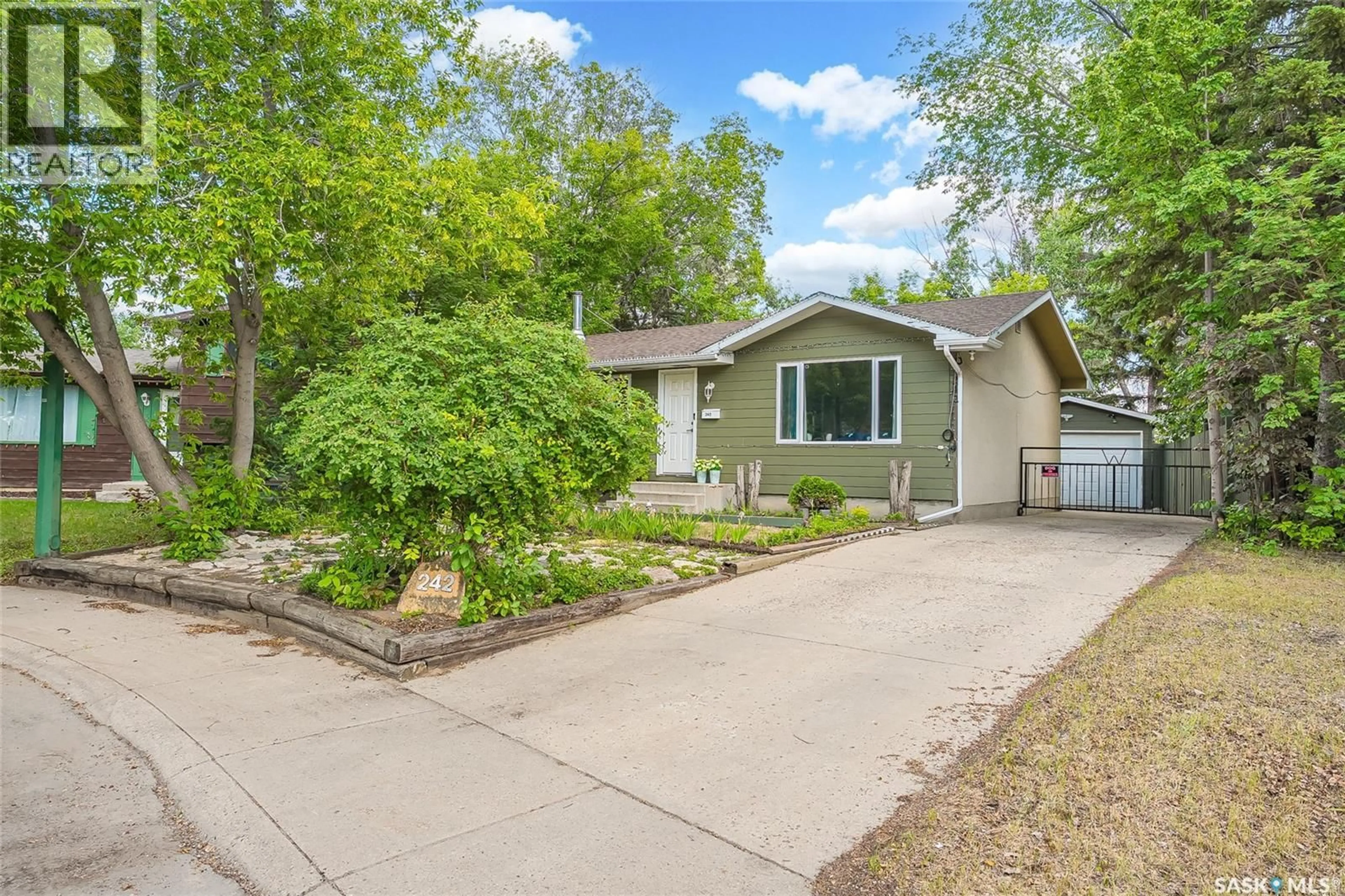 Home with vinyl exterior material, street for 242 HAVILAND CRESCENT, Saskatoon Saskatchewan S7L5A7