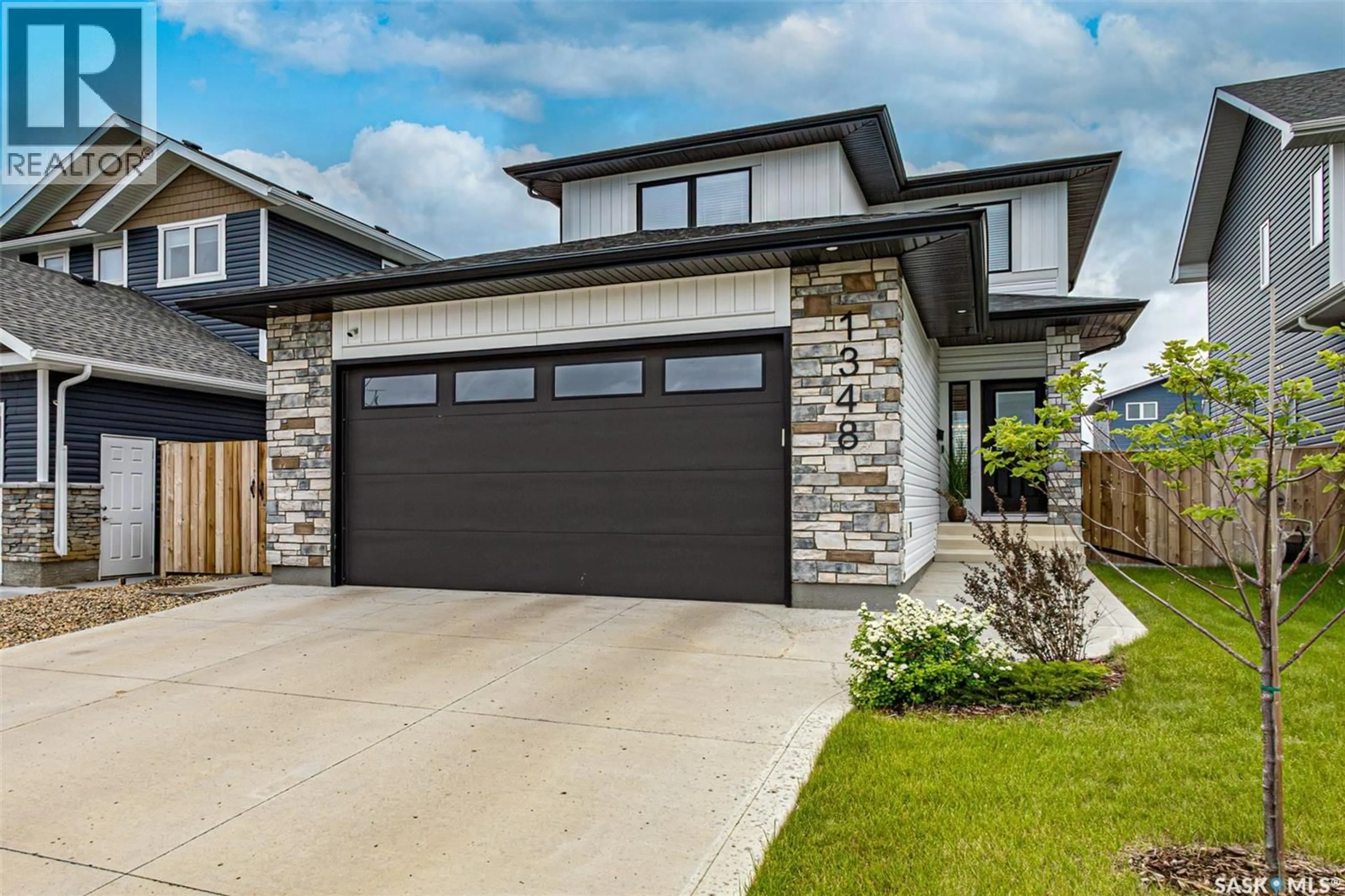Home with brick exterior material, street for 1348 PARR HILL DRIVE, Martensville Saskatchewan S0K2T1