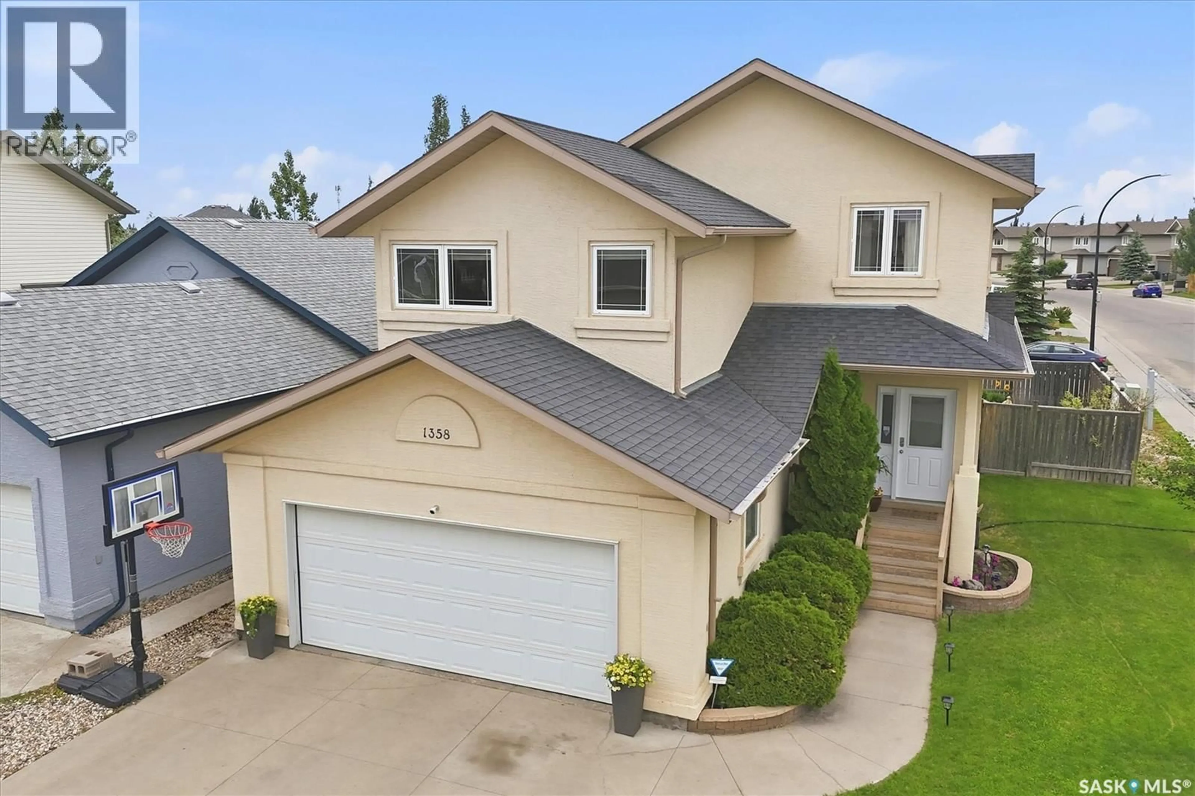 A pic from outside/outdoor area/front of a property/back of a property/a pic from drone, street for 1358 DENHAM CRESCENT, Saskatoon Saskatchewan S7R0B1