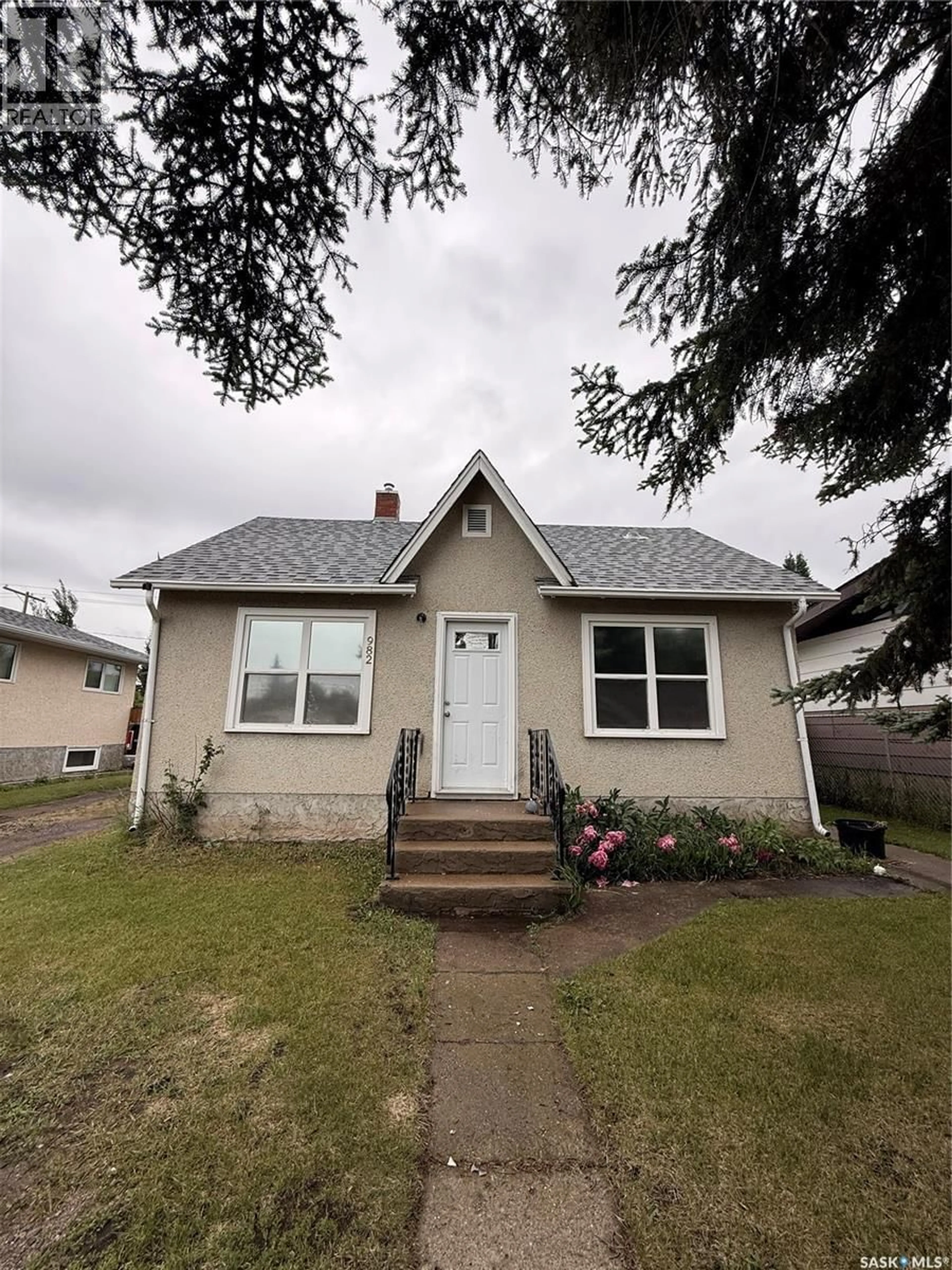 Home with vinyl exterior material, street for 982 12TH STREET, Prince Albert Saskatchewan S6V3C7